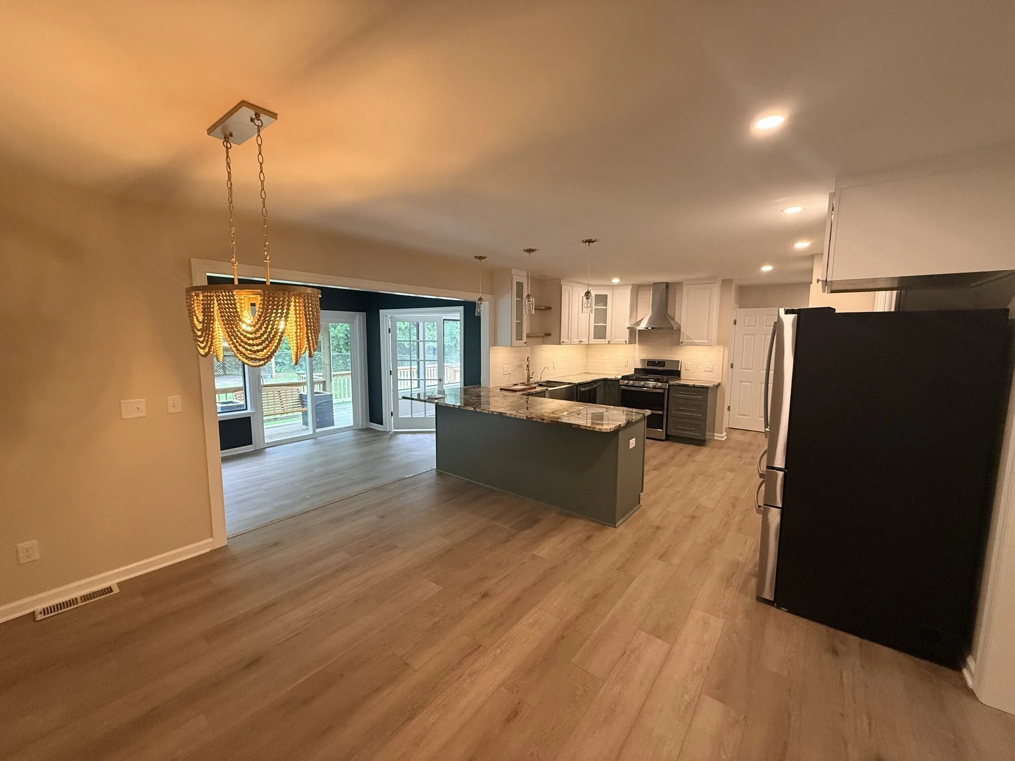 After — the new dining area with updated fixture and new flooring