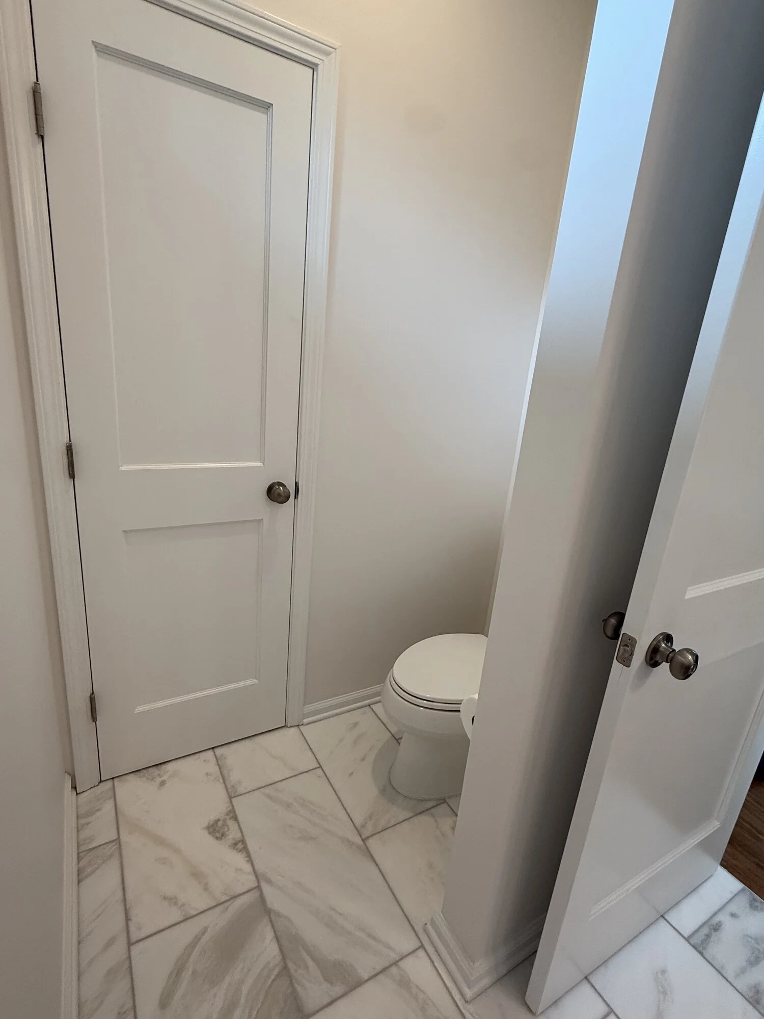 After — linen closet and water closet finishing out the suite