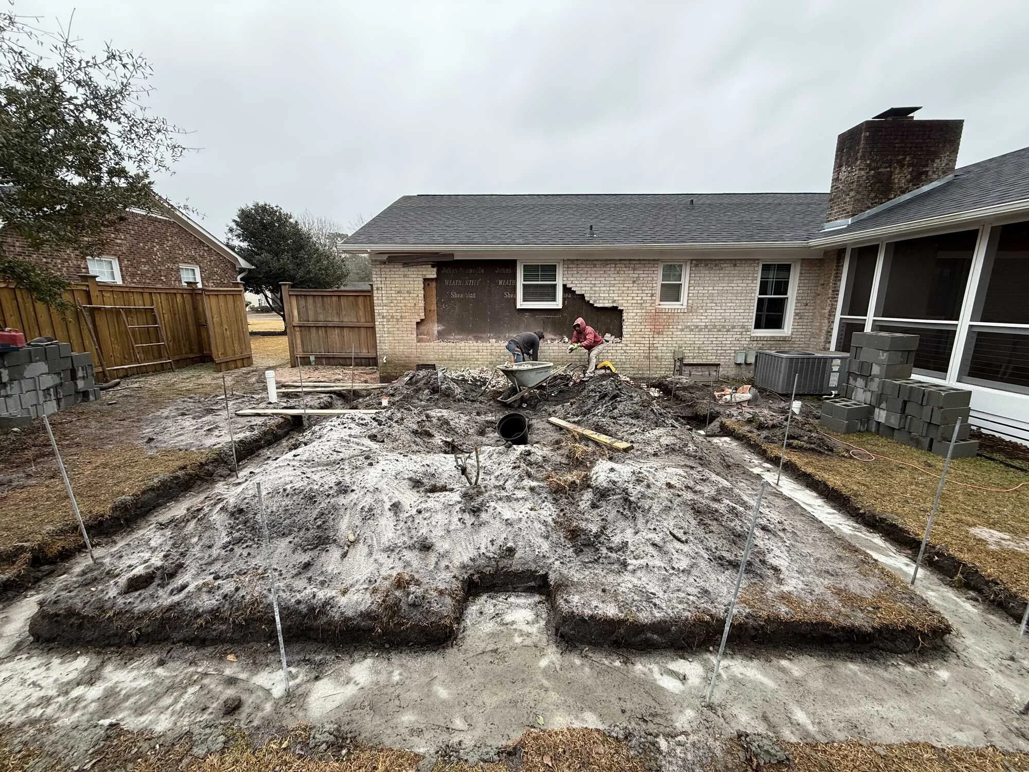 Before — footings poured and block foundation about to go up for the new suite