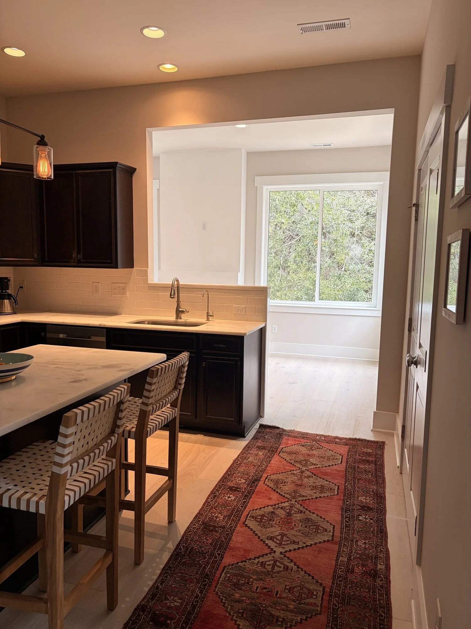 After — new family room flowing back toward the kitchen and bar