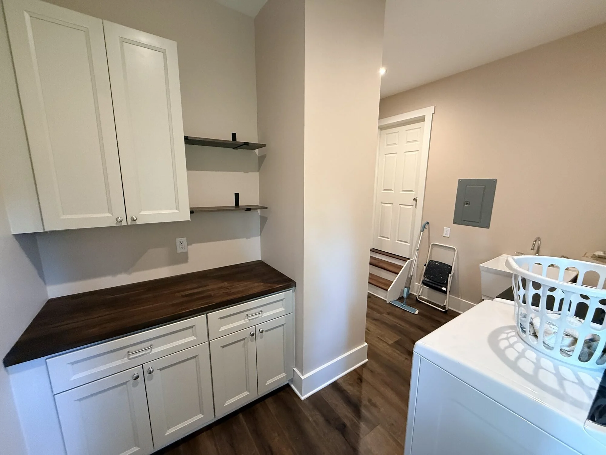 After — base cabinets and utility sink ready for shop and laundry duty
