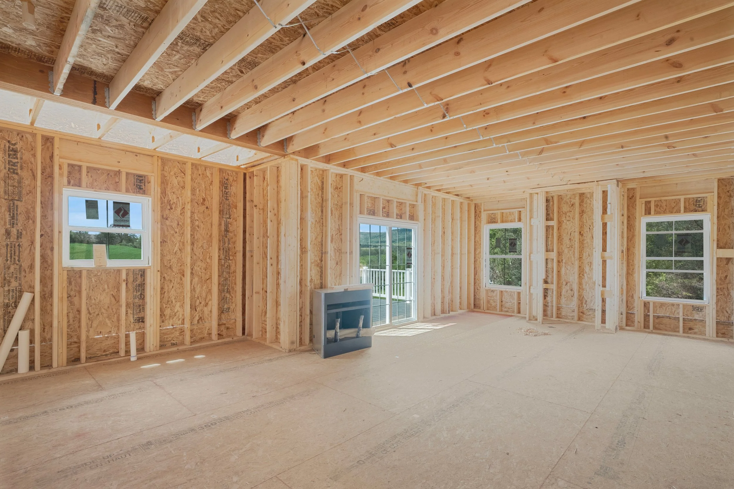 Framed newly built living room with rear deck and farm views in Hamburg, PA