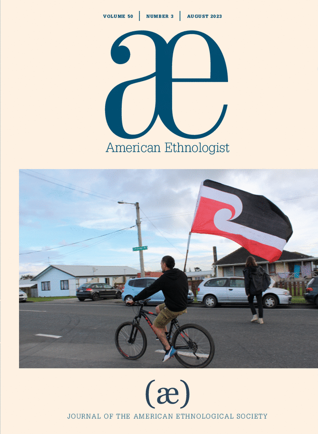 Cover of American Ethnologist journal, August 2023, featuring a cyclist holding a red, white, and black flag in a suburban street scene.