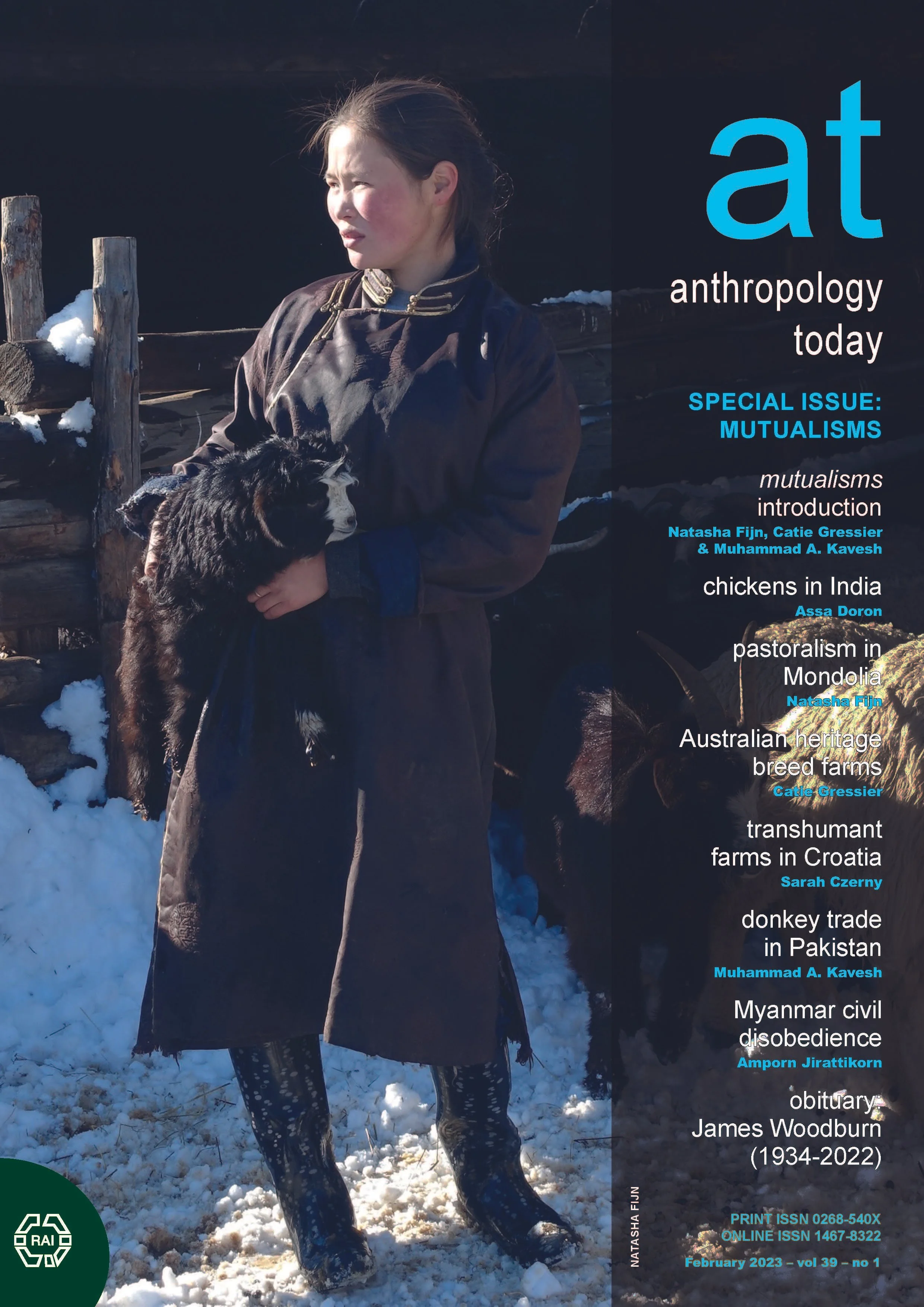 Magazine cover of Anthropology Today featuring a woman in traditional clothing holding a black and white animal, standing in snow next to a wooden fence. The cover includes titles related to various anthropological topics such as mutualisms, pastoralism, and heritage breed farms.