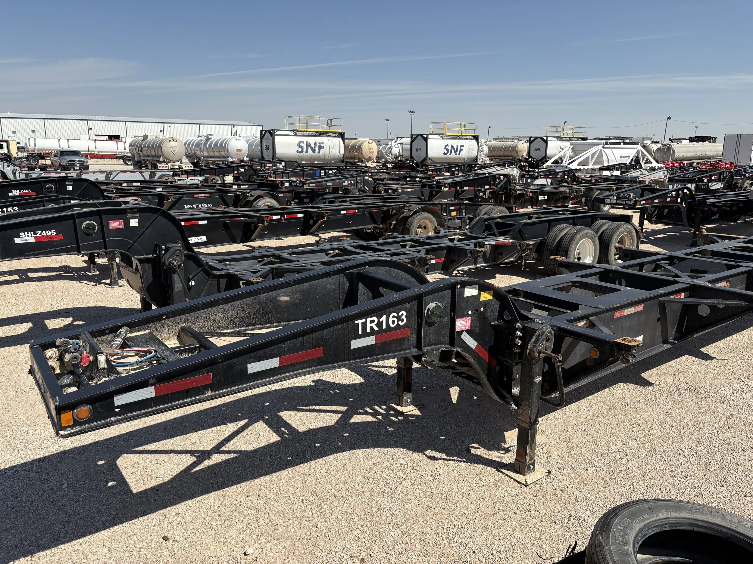 a_bunch_of_sand_chassis_trailers.JPG