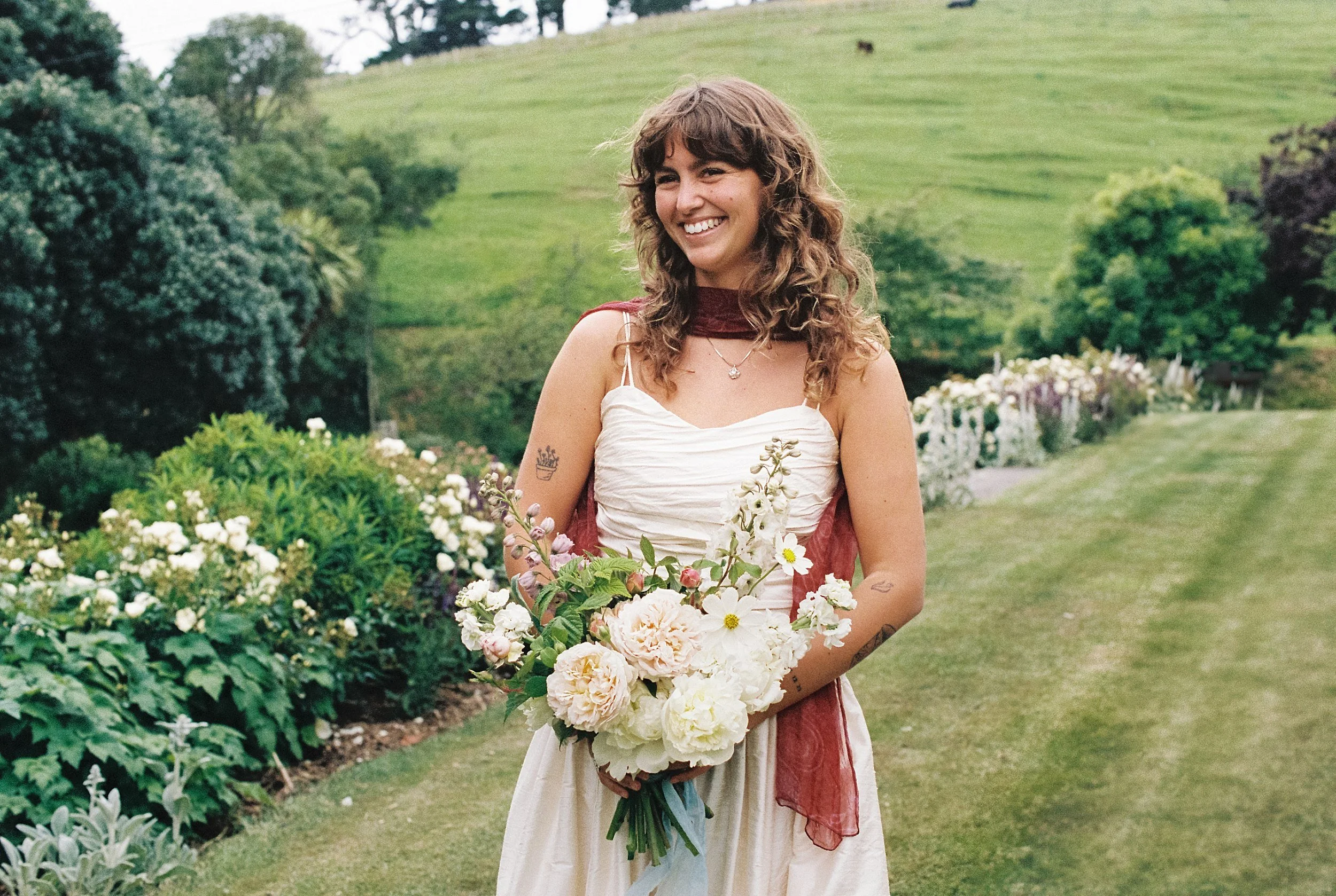 Bride holding locally grown flowers at ridgecliff farm