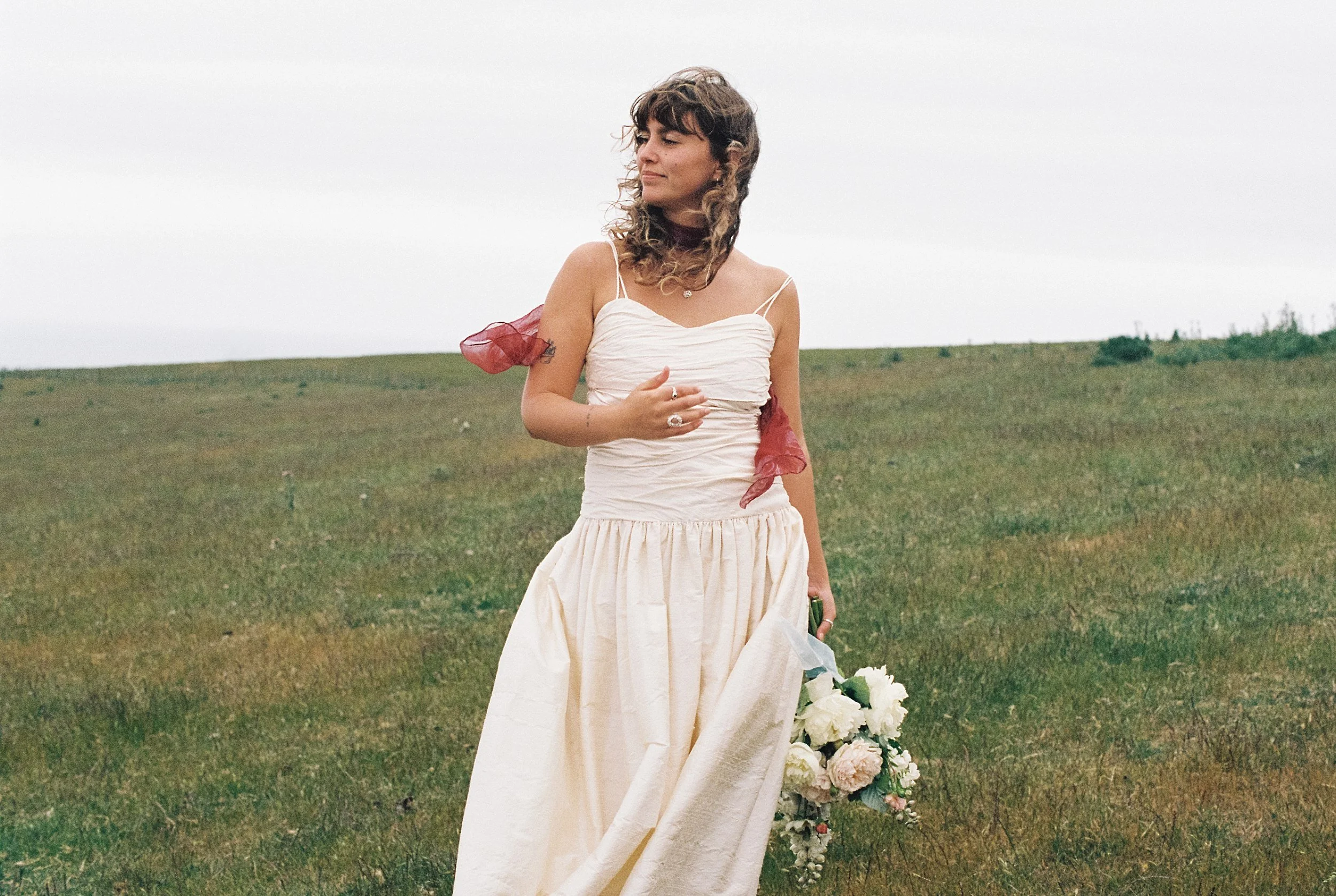 Bride wearing Vintage cream wedding dress at ridgecliff farm in christchurch