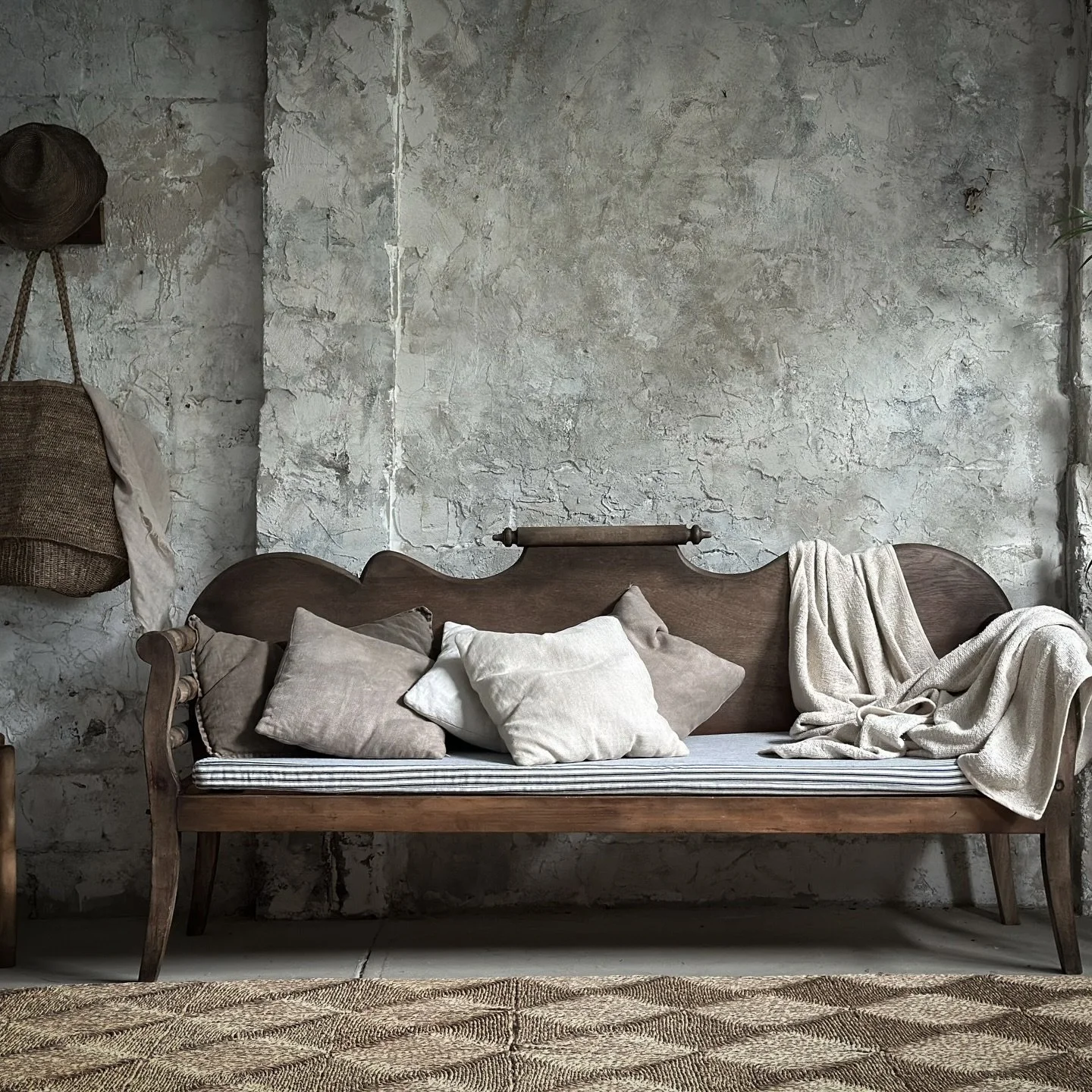 A cherished 20th-century Australian miner&rsquo;s couch, worn smooth by years of living and full of quiet character. Its single curved backboard, rolling-pin finial, and gently turned arms  reflect a rare, rustic beauty&mdash;crafted with simplicity,