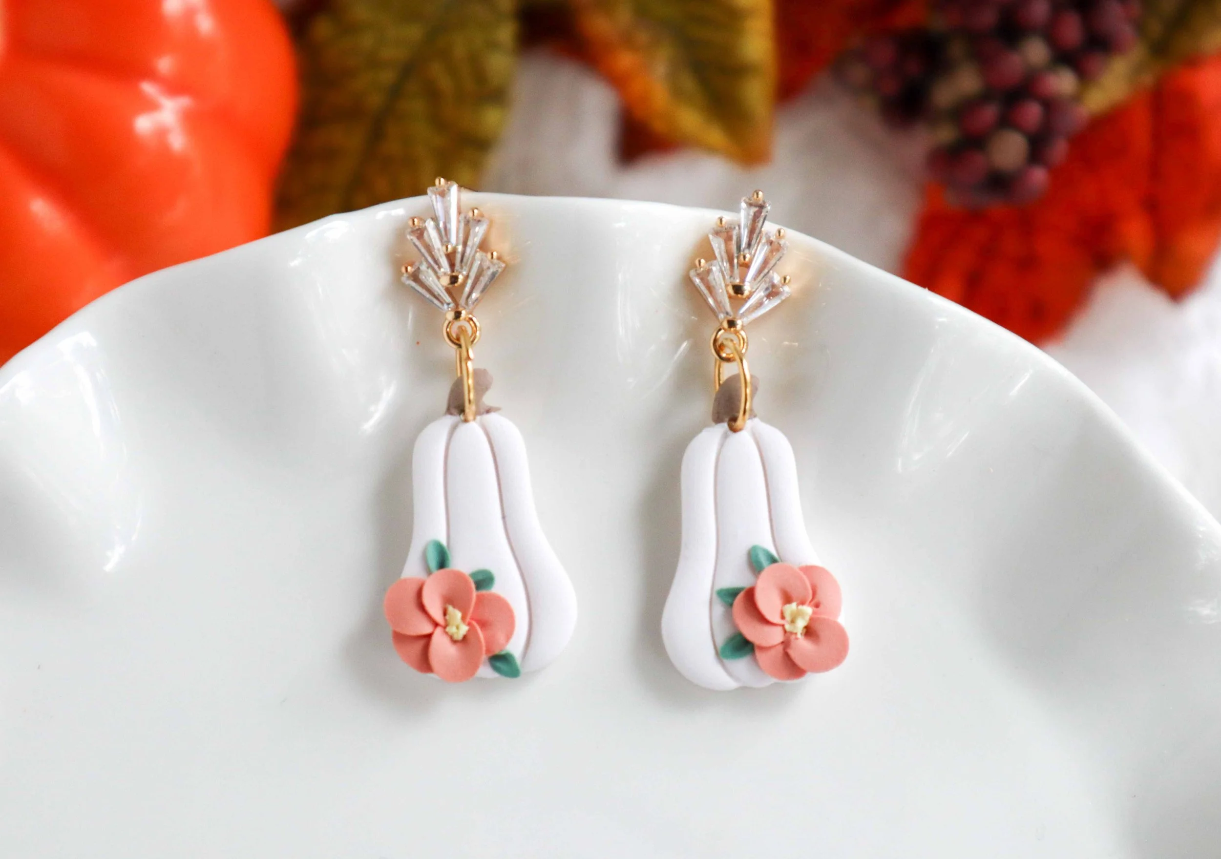 White Floral Polymer Pumpkin Earrings