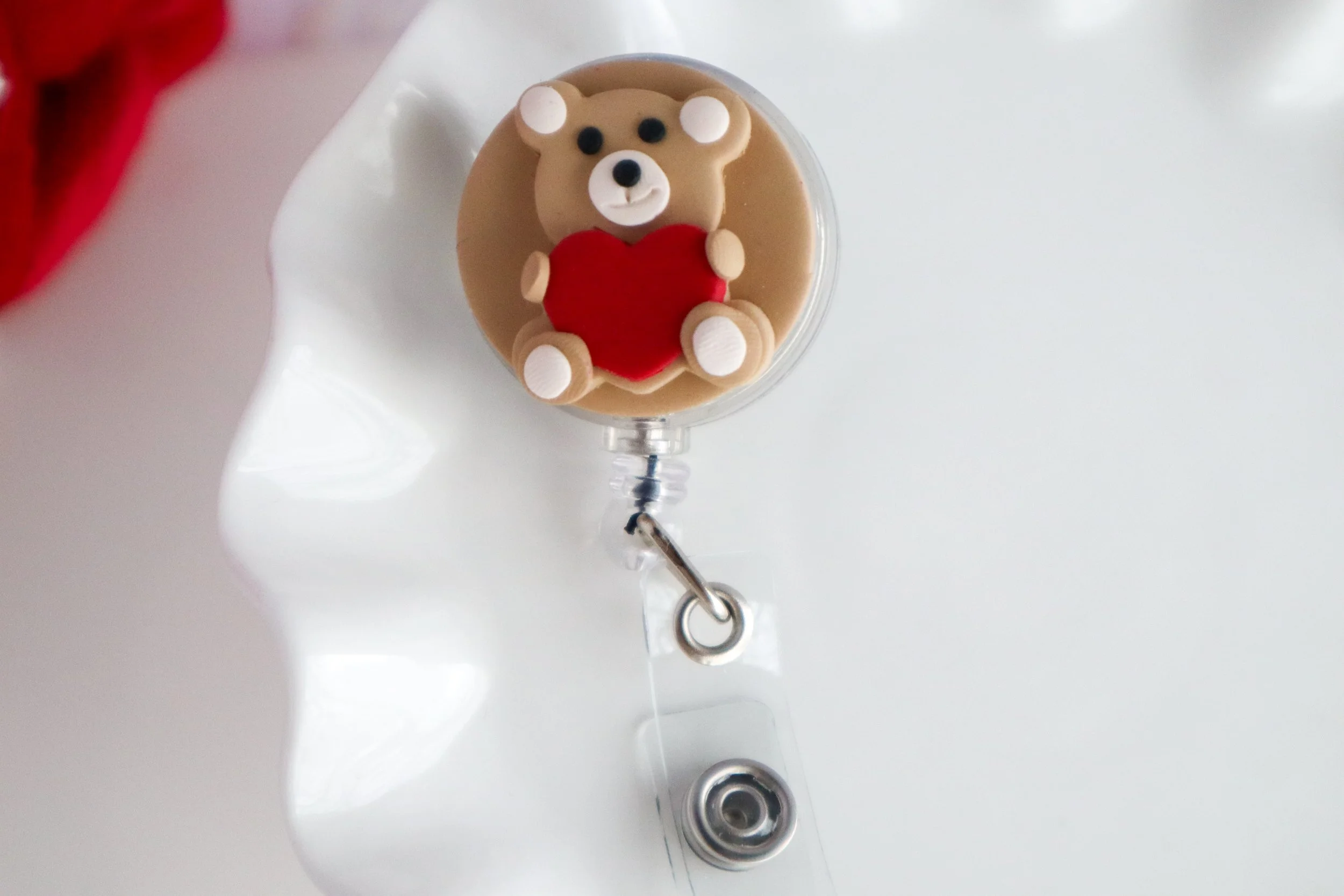 Teddy Bear Holding a Heart- Badge Reel