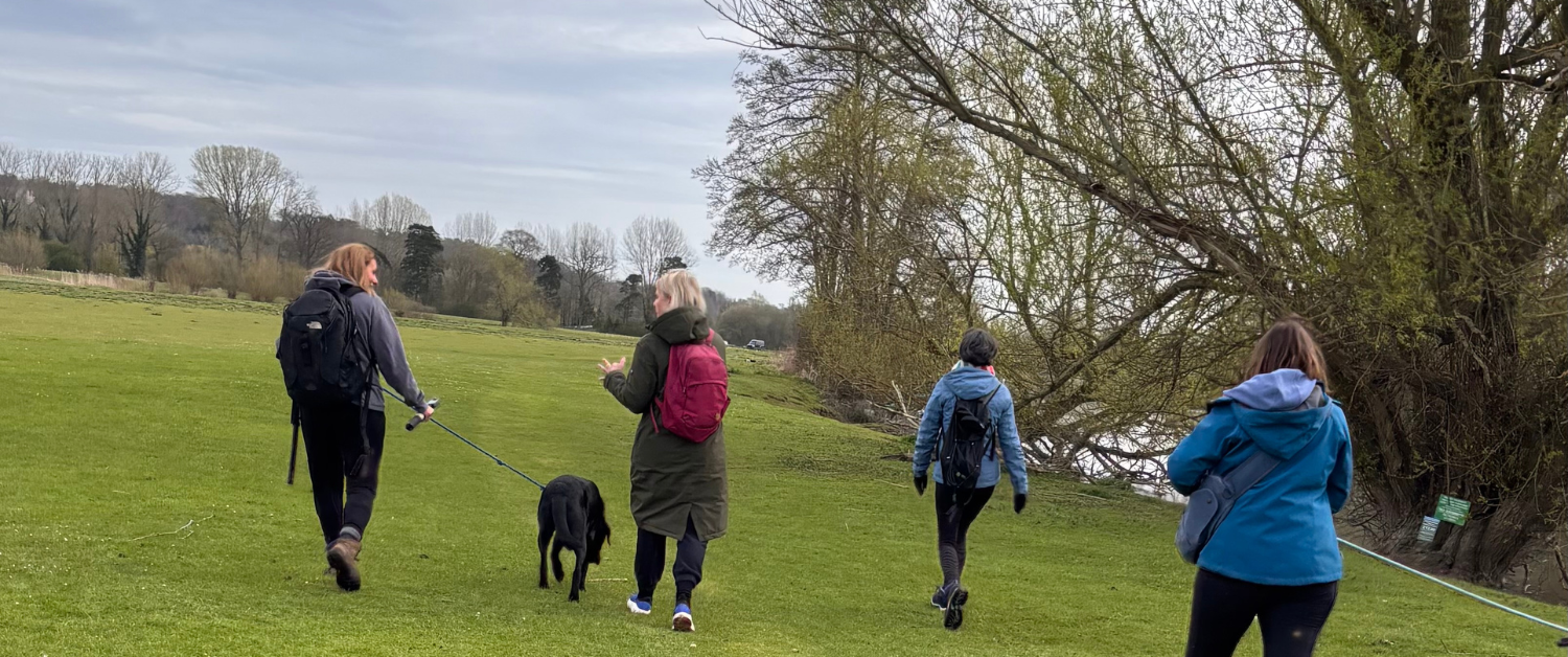 Women walking beside the river near Marlow during a guided countryside walk