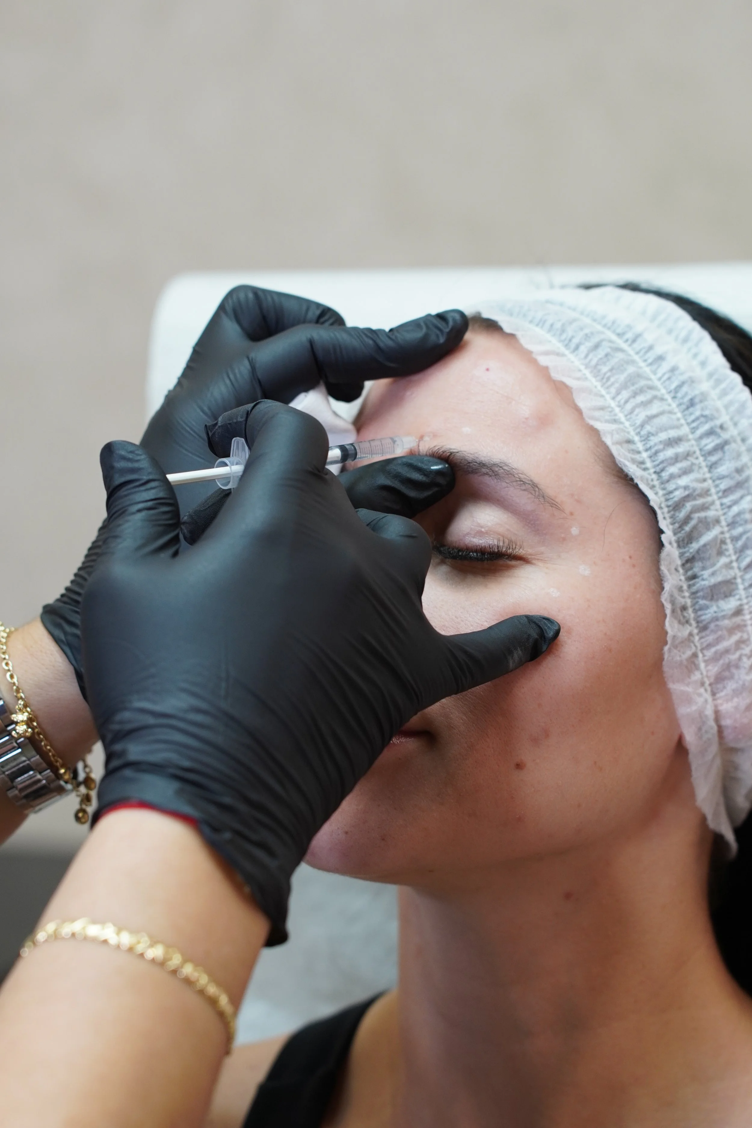 WOMEN GETTING INJECTED WITH BOTOX OR DYSPORT