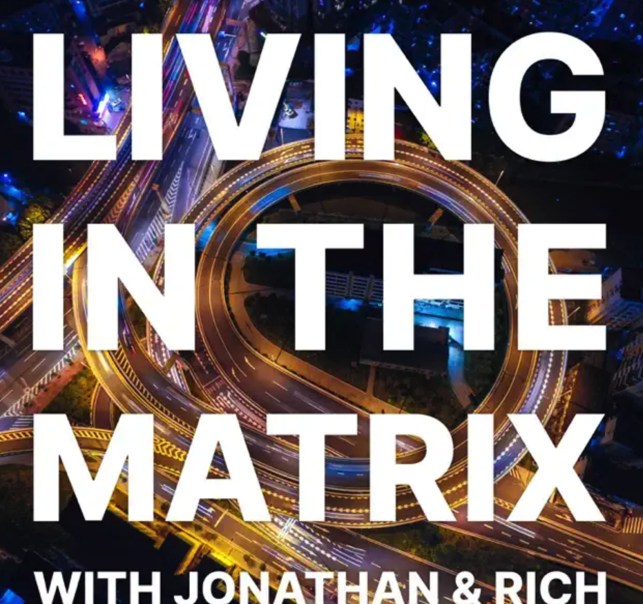 Aerial view of a highway interchange with text overlay saying 'Living in the Matrix with Jonathan & Rich.'