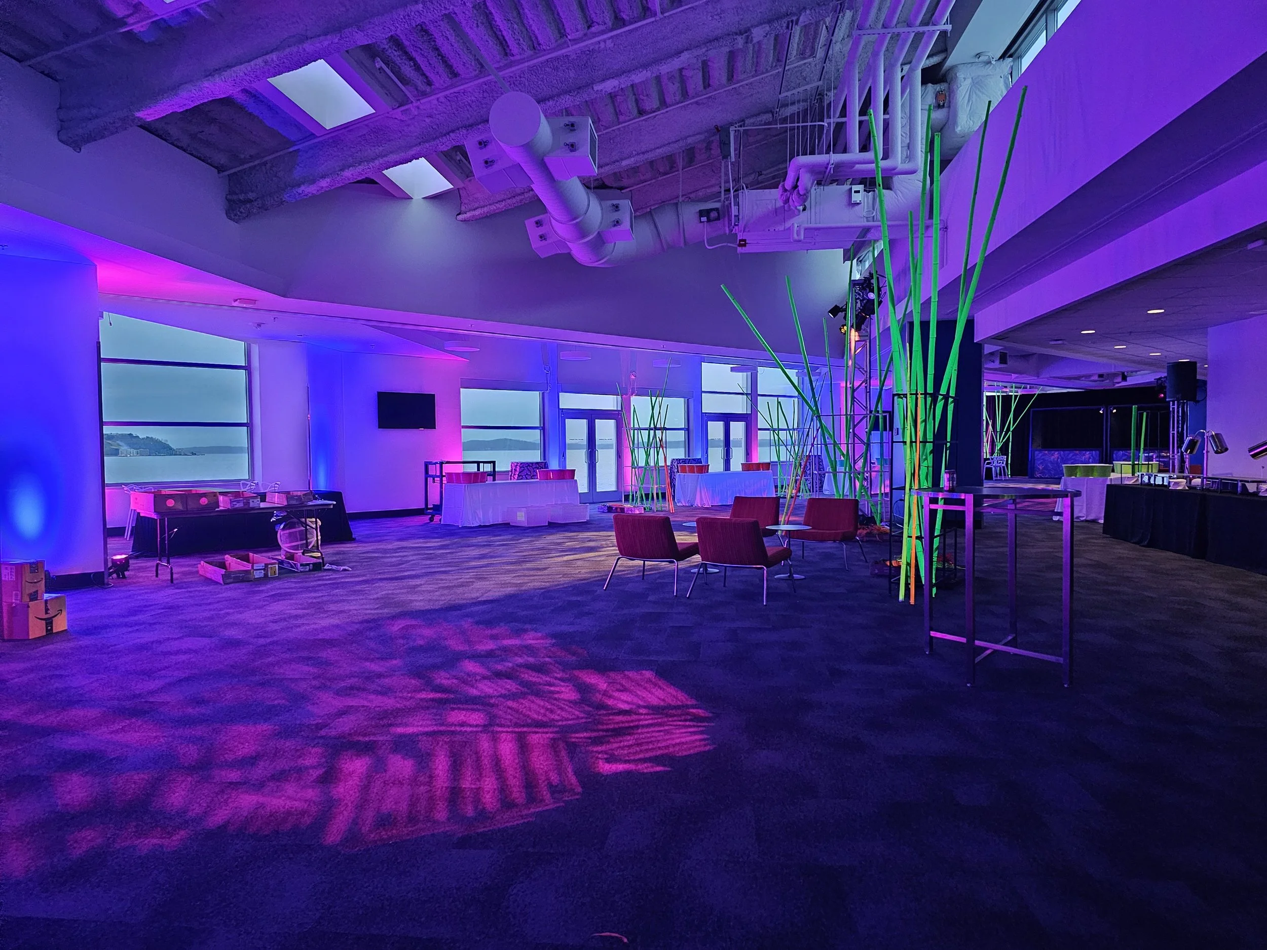 Immersive environment using UV lighting on reactive props and for a company party.