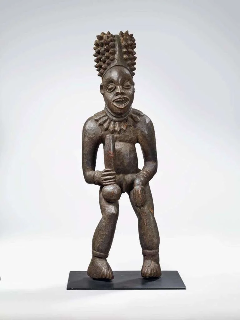  Commemorative  Lefem  King Statue 
 Bangwa People, Fontem Cameroon 
 19th century 
 Hardwood with dark sheen 
 Musée du quai Branly, Paris. 
 (Photo: Collection Marc Ladreit de Lacharrière, Musée du quai Branly). 
 Note: This notable example was sol