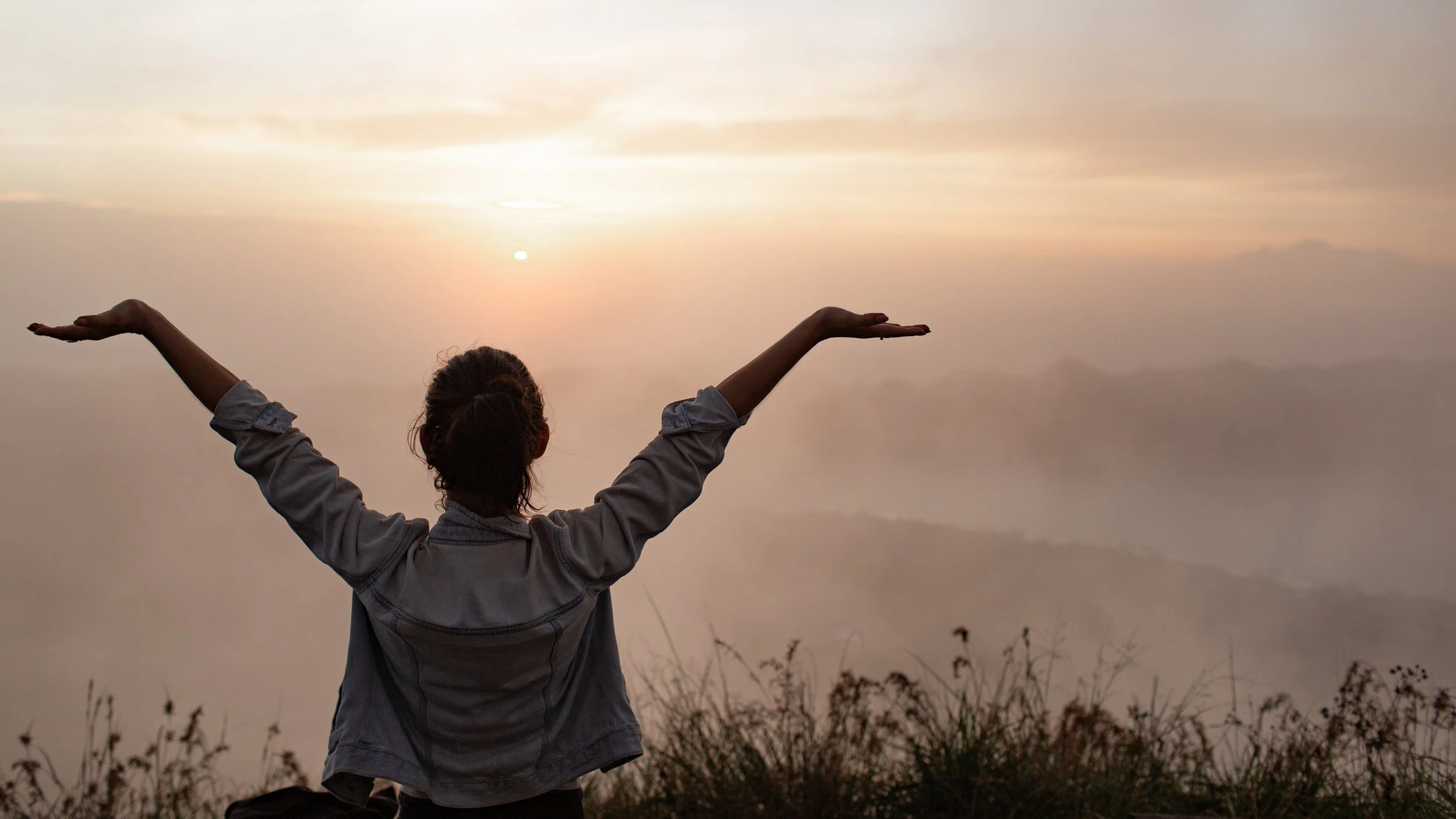 Woman with arms up feeling good