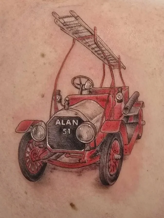 A vintage fire truck illustration with the name 'ALAN' and number '51' on the front grill.