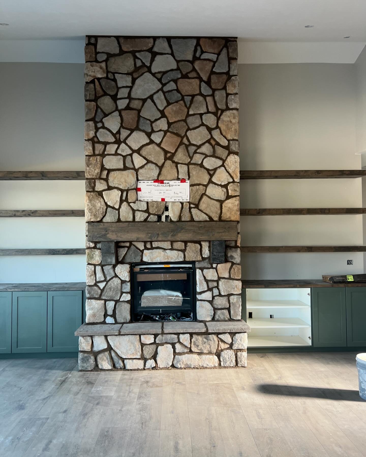 &ldquo;Check out our latest project! 🔥 We recently completed a stunning stone installation on a 13 ft high fireplace, elegantly adorned with floating shelves on the sides. The rich combination of brown hues creates a truly captivating aesthetic. ✨ #