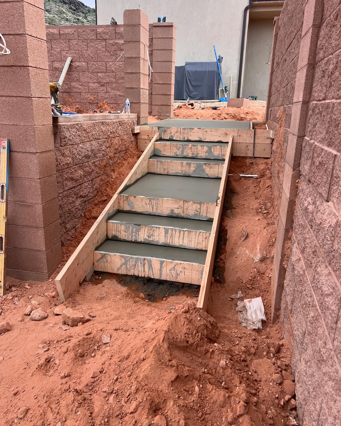 &ldquo;Another successful project completed! ✅ We&rsquo;ve built concrete steps with a 3-foot landing and installed block retaining walls for the spa, along with a concrete base to support it. 💪 #construction #concrete #project #success #landscaping