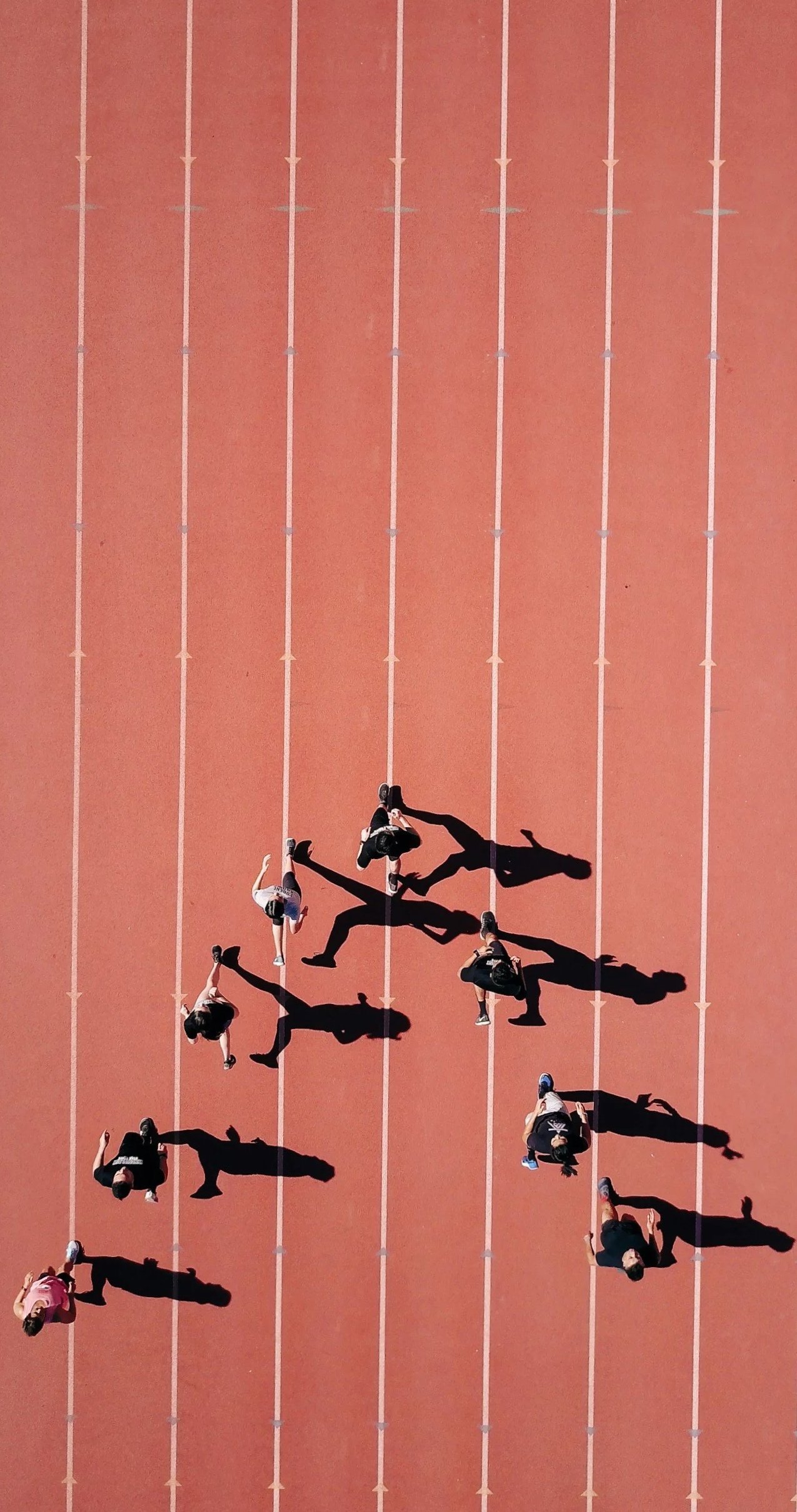 Athletes running on a running track