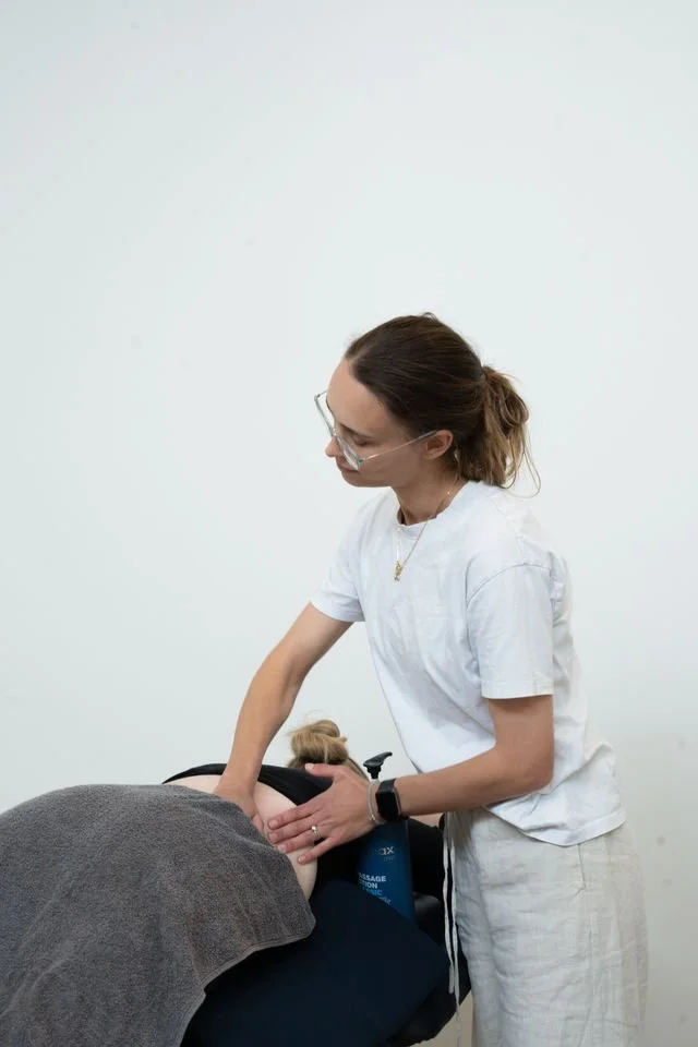 Physiotherapist treating pregnant women with massage and pain management at Base Movements Physiotherapy Adelaide CBD