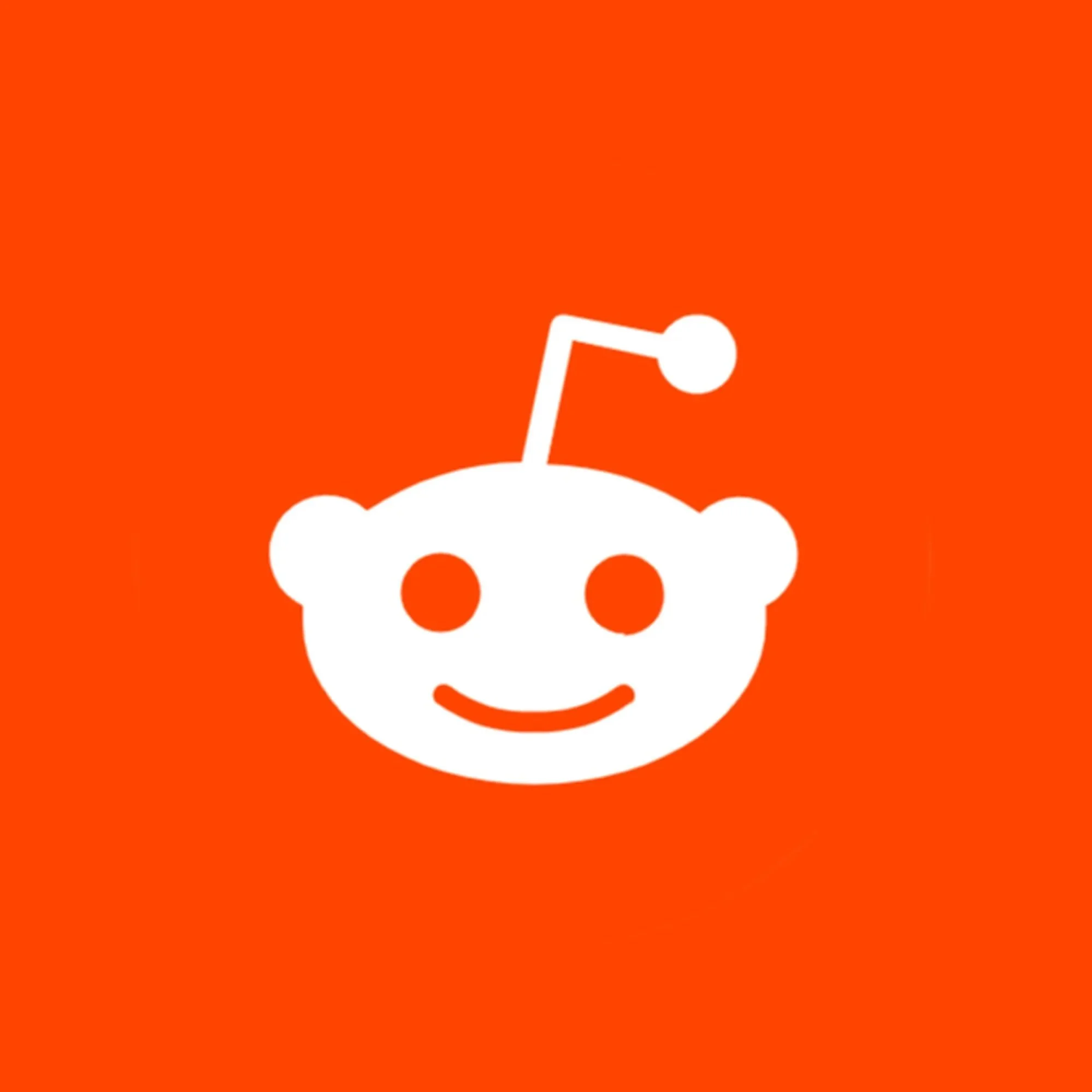 Red background with a white Reddit alien logo face, including a smiling mouth and an antenna.