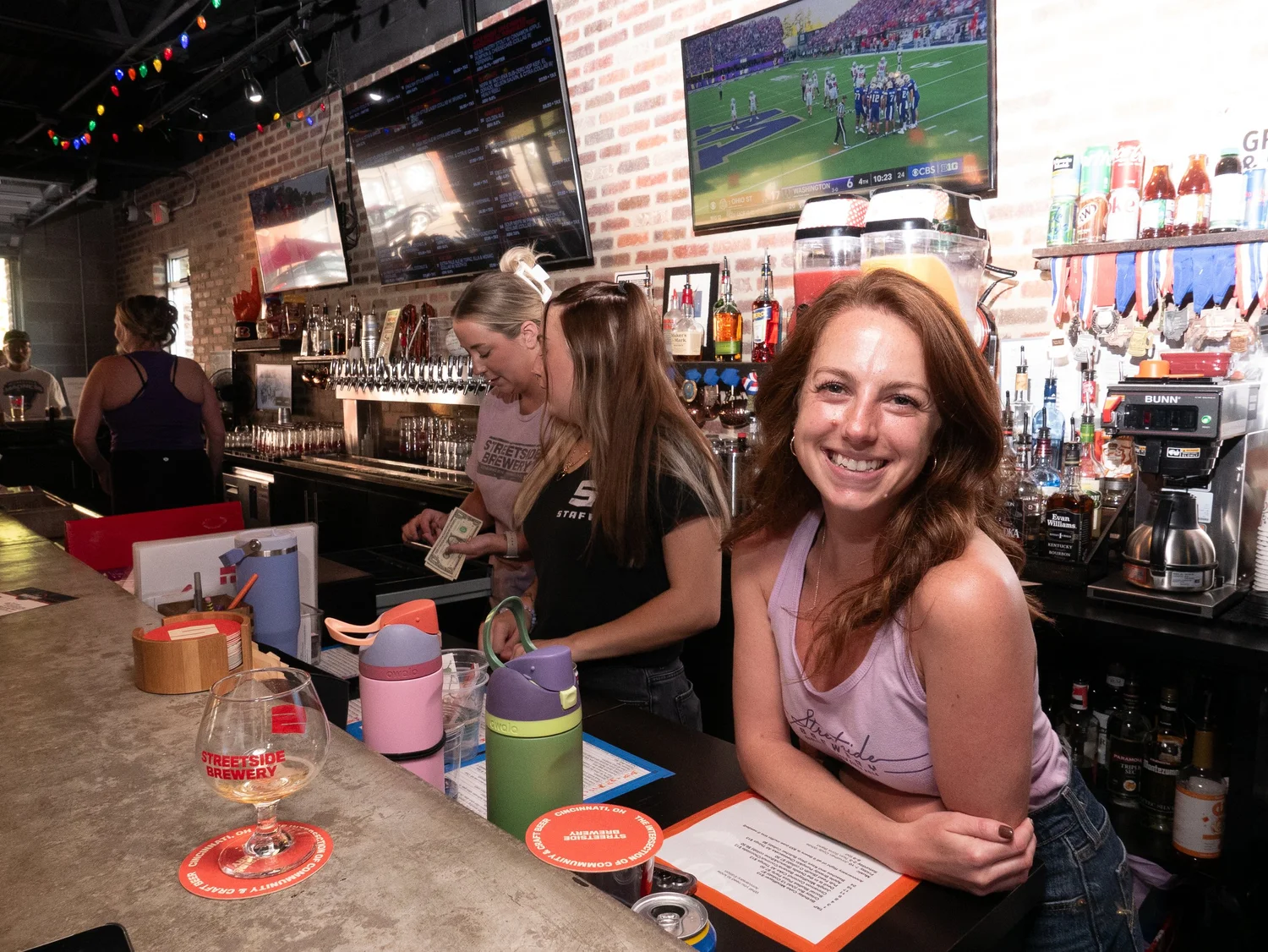 Streetside Brewery back bar with tap handles and brick walls