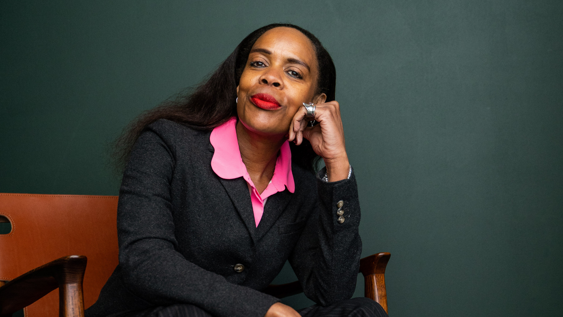 A confident woman sitting on a chair