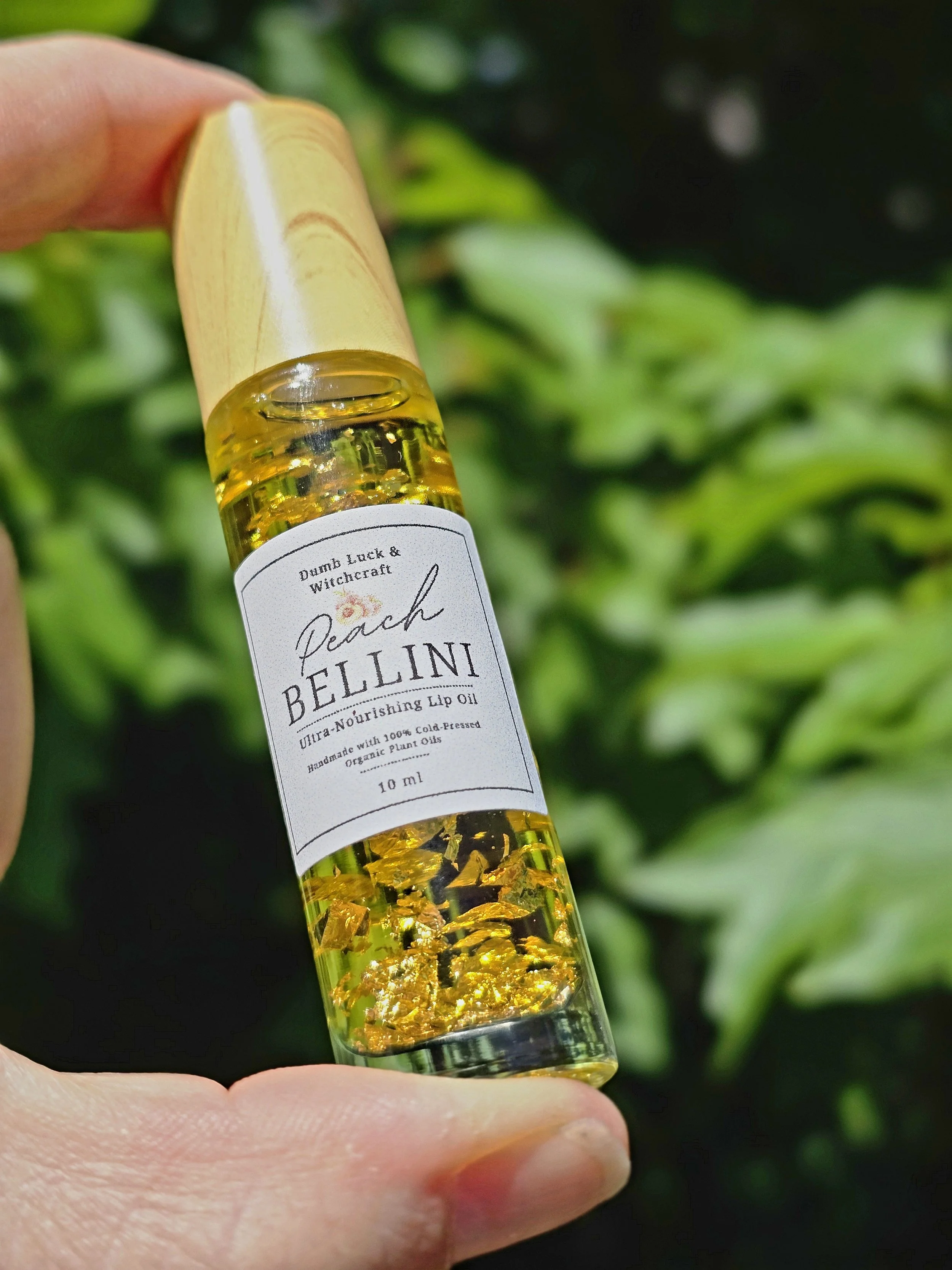 Peach Bellini Ultra-Nourishing Flavored Lip Oil with Edible Gold Flake!