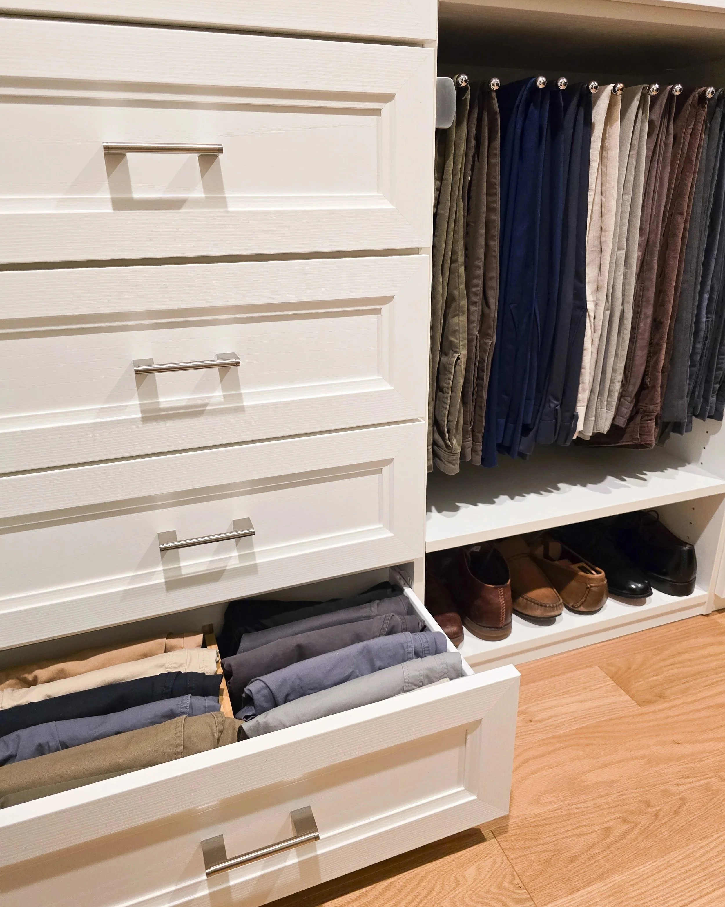 closet organization. White drawers, color coded pantst