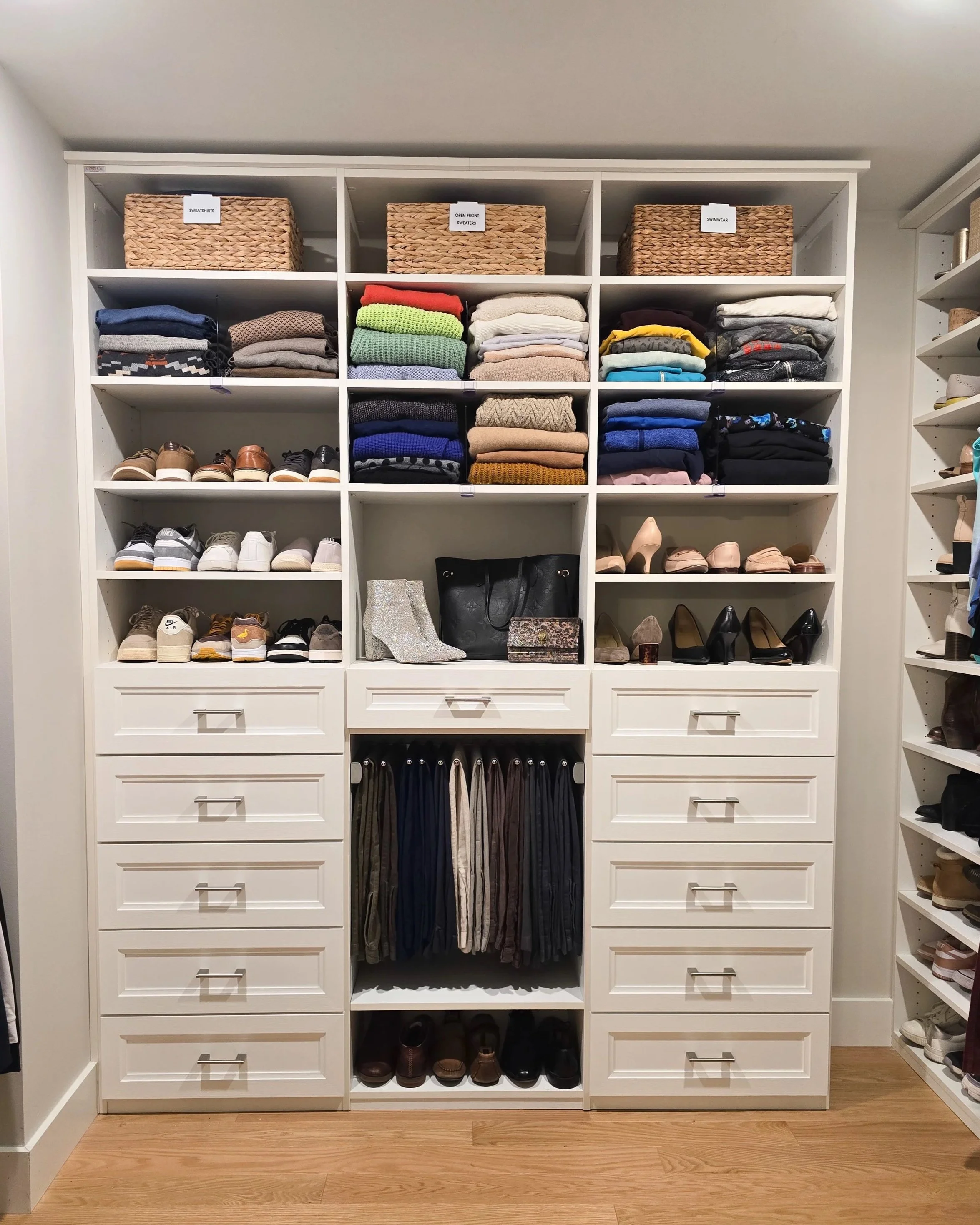 ladies and men's closet, shoe storage, pant organization, sweaters, baskets with labels