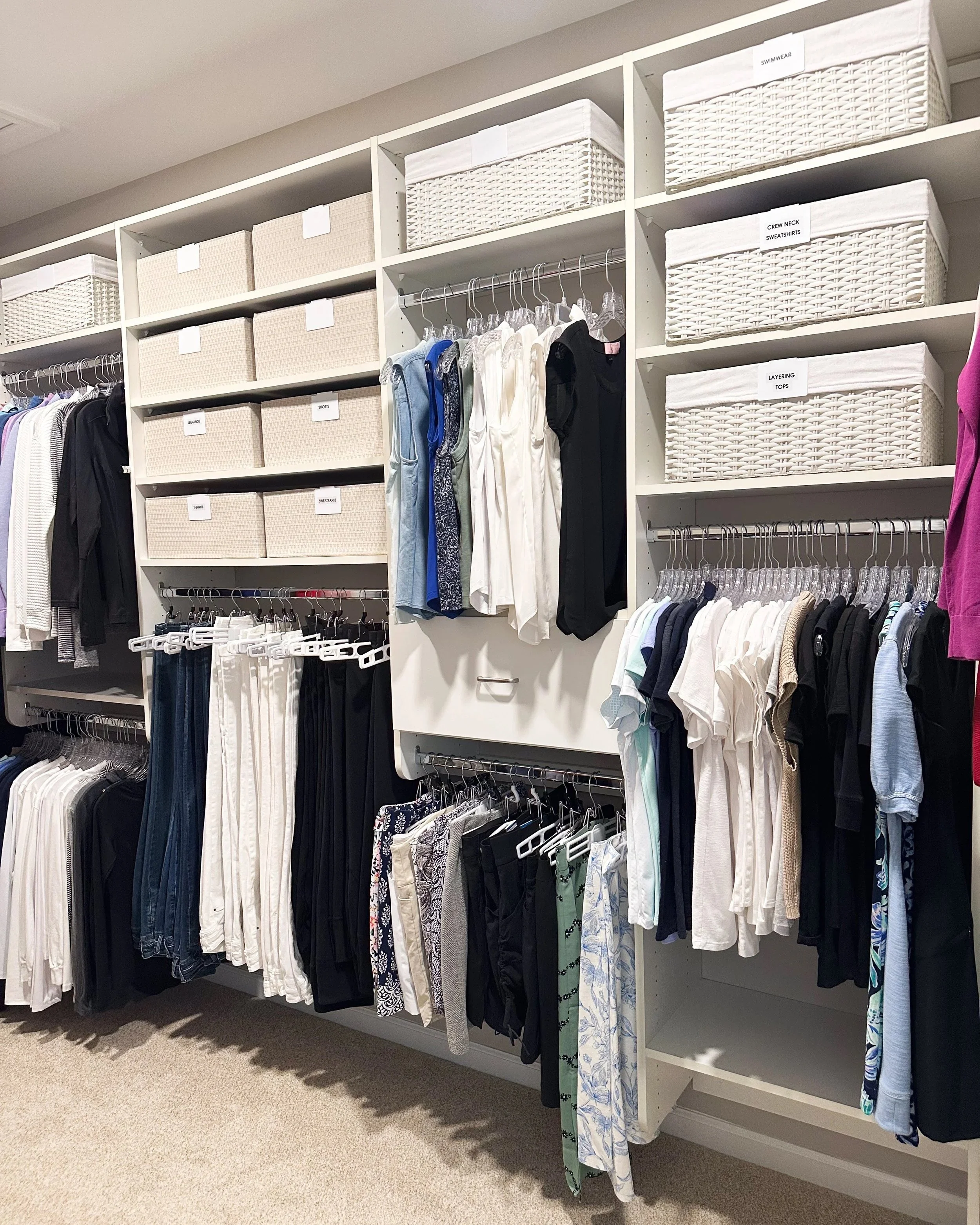 closet organization, hanging pants, color coded shirts, pants, labeled closet baskets