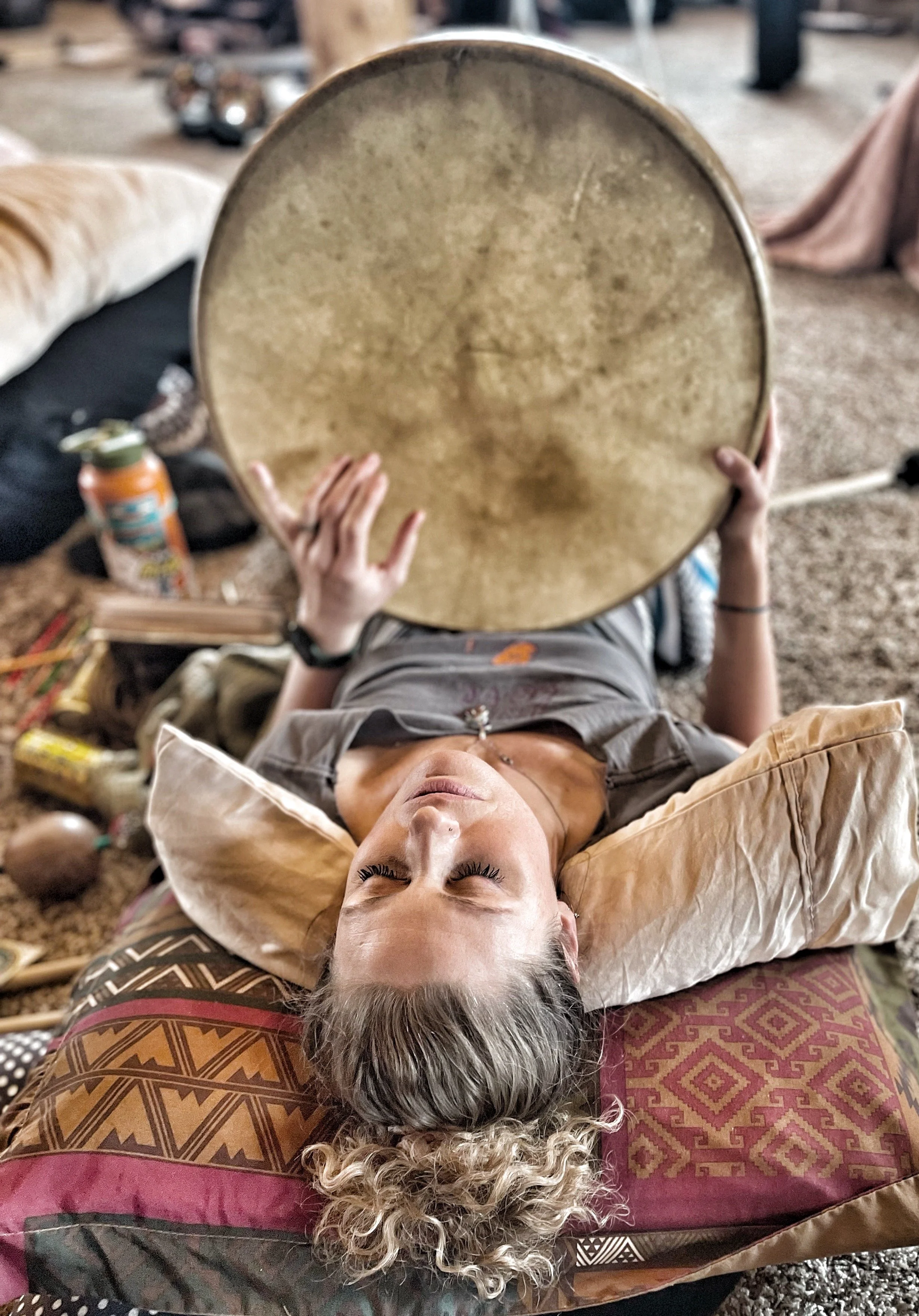 woman with drum whil laying down.JPG