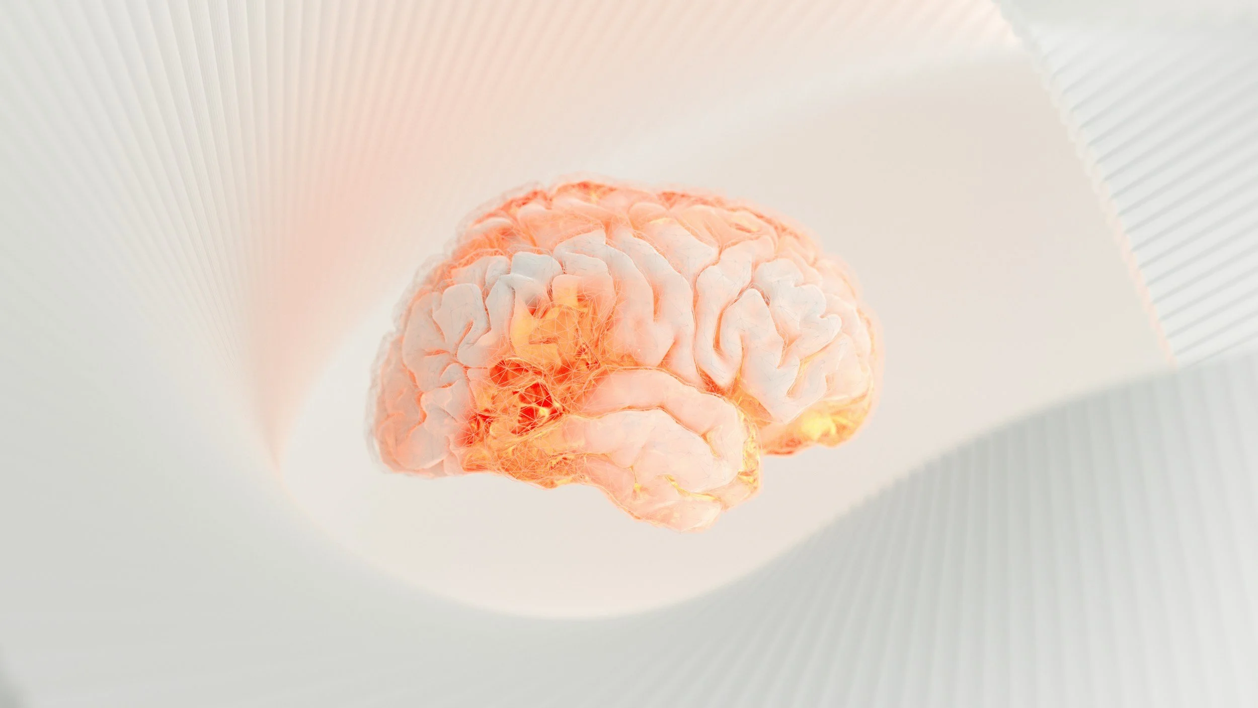 A brightly lit 3D illustration of a human brain, suspended in space with a soft glow around it.
