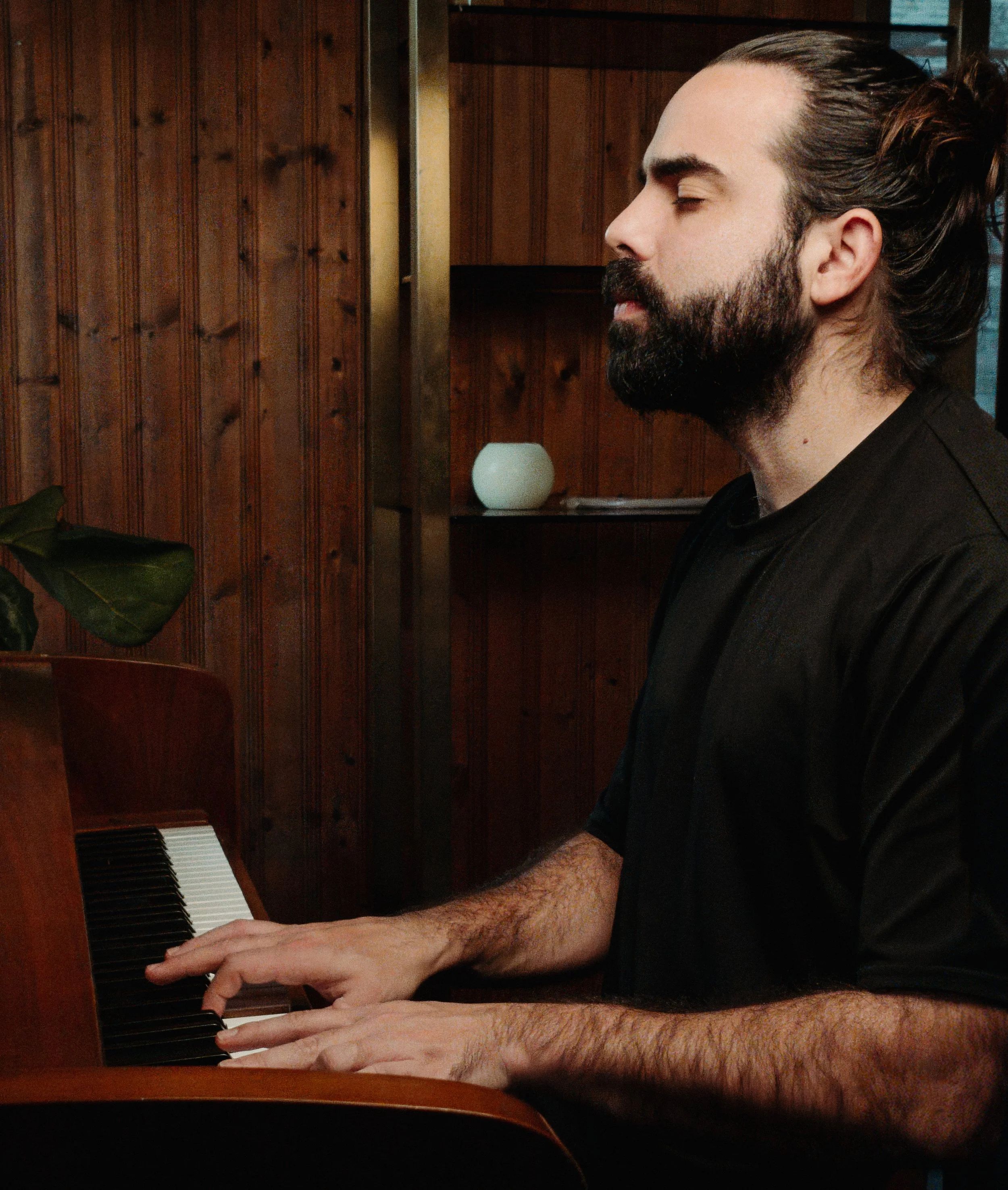 Music instructor teaching piano during a private lesson