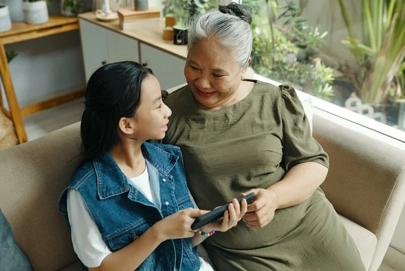 Grandma and granddaughter displaying emotional safety in a healthy relationship