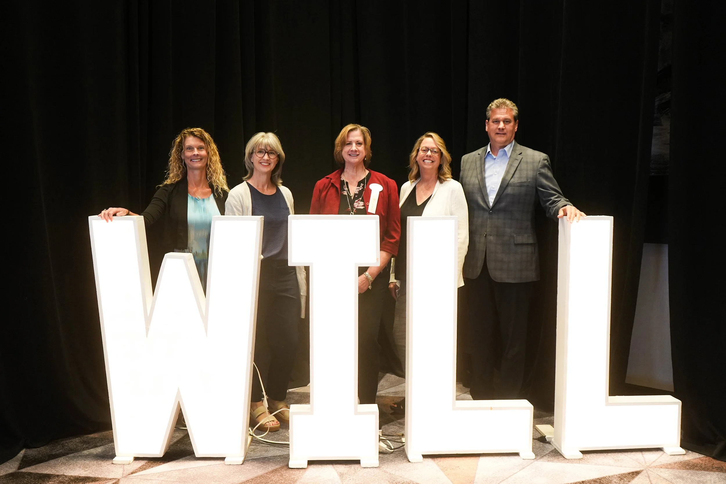  Sandra Rocco-Melville, Executive Director wins Women in Leadership award and poses with Executive Leadership Team members from Noah Homes.  