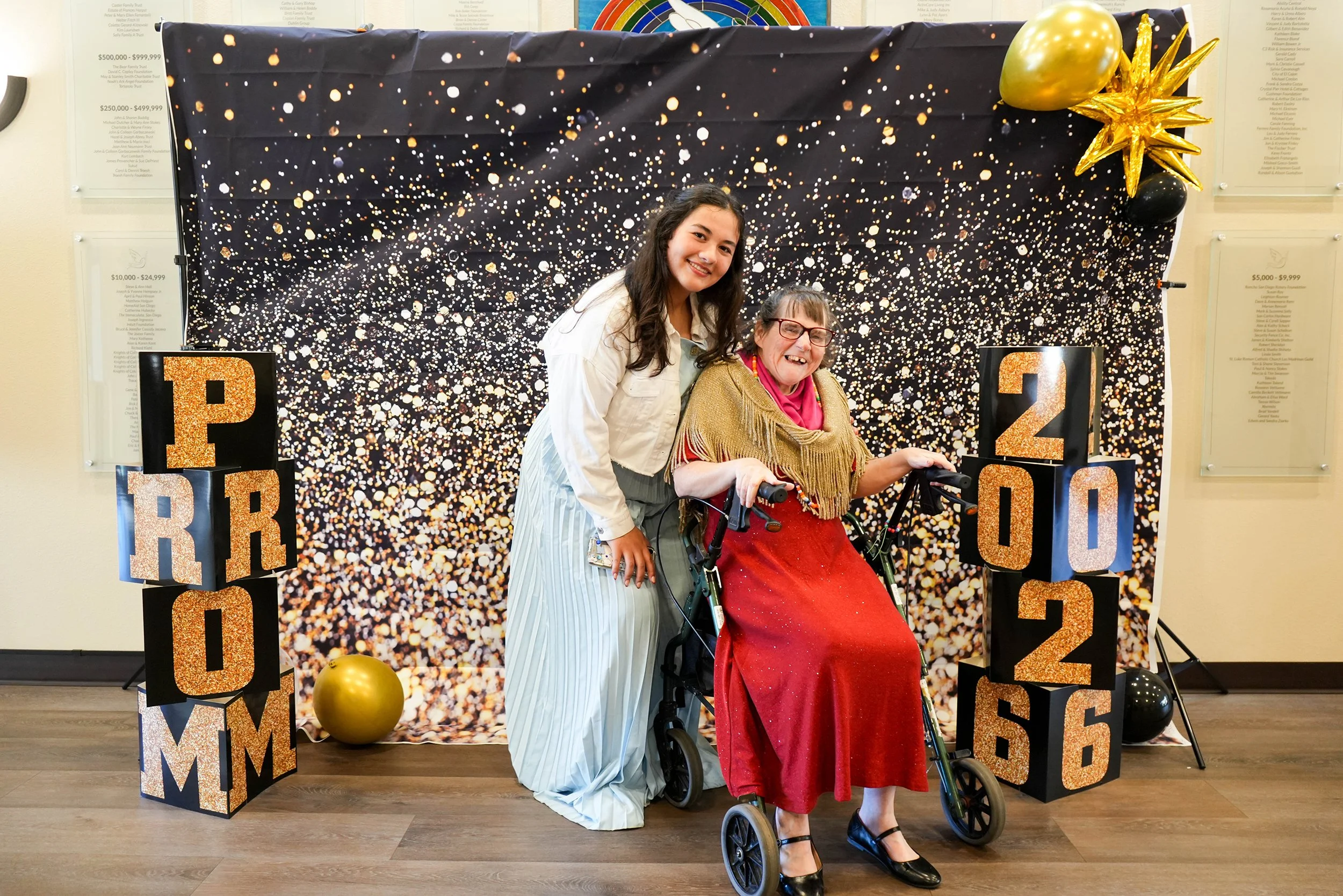  Resident Kim poses alongside one of our Direct Support Professional’s 
