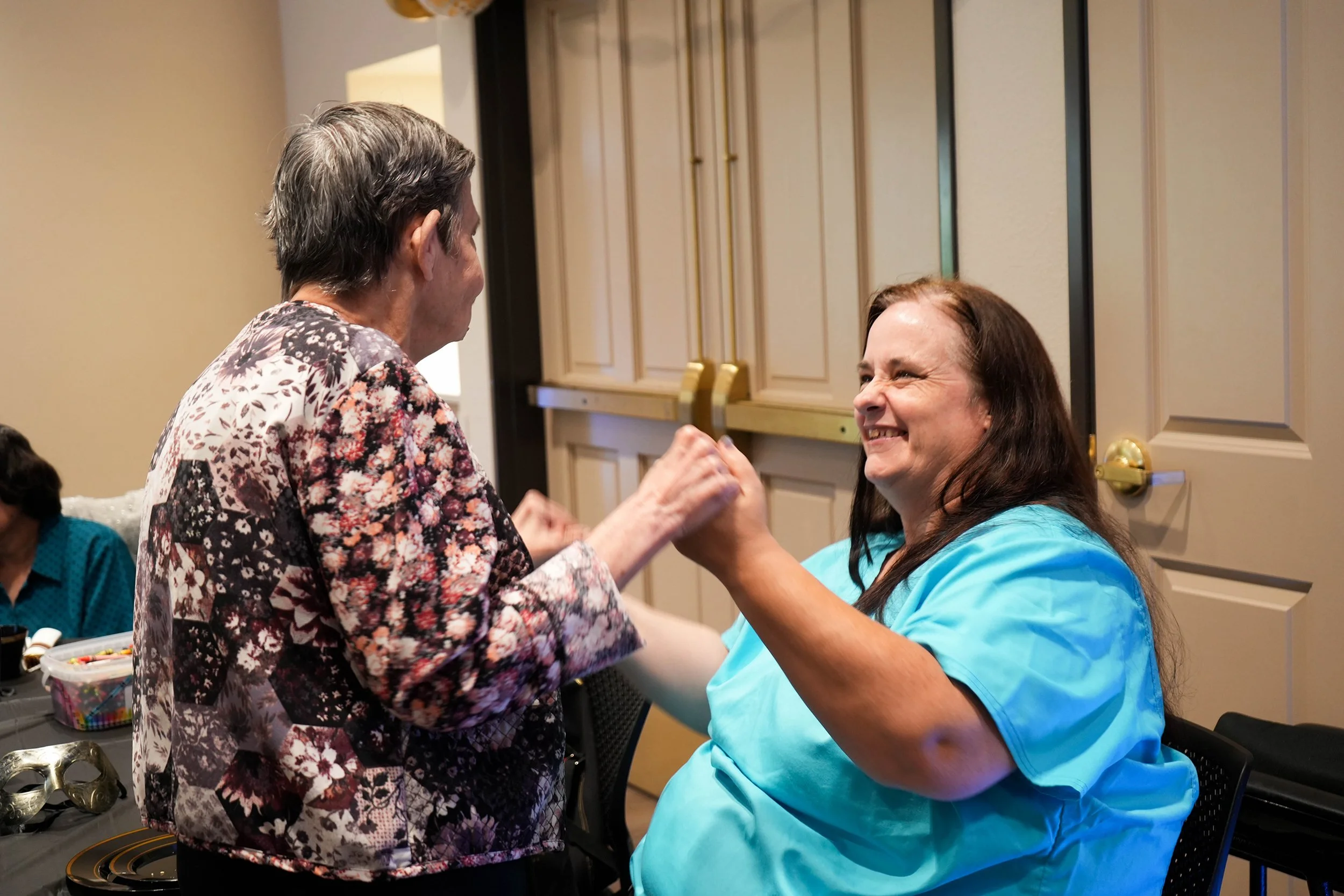  Direct Support Professional, Patty dances with one of the Noah Homes resident’s 