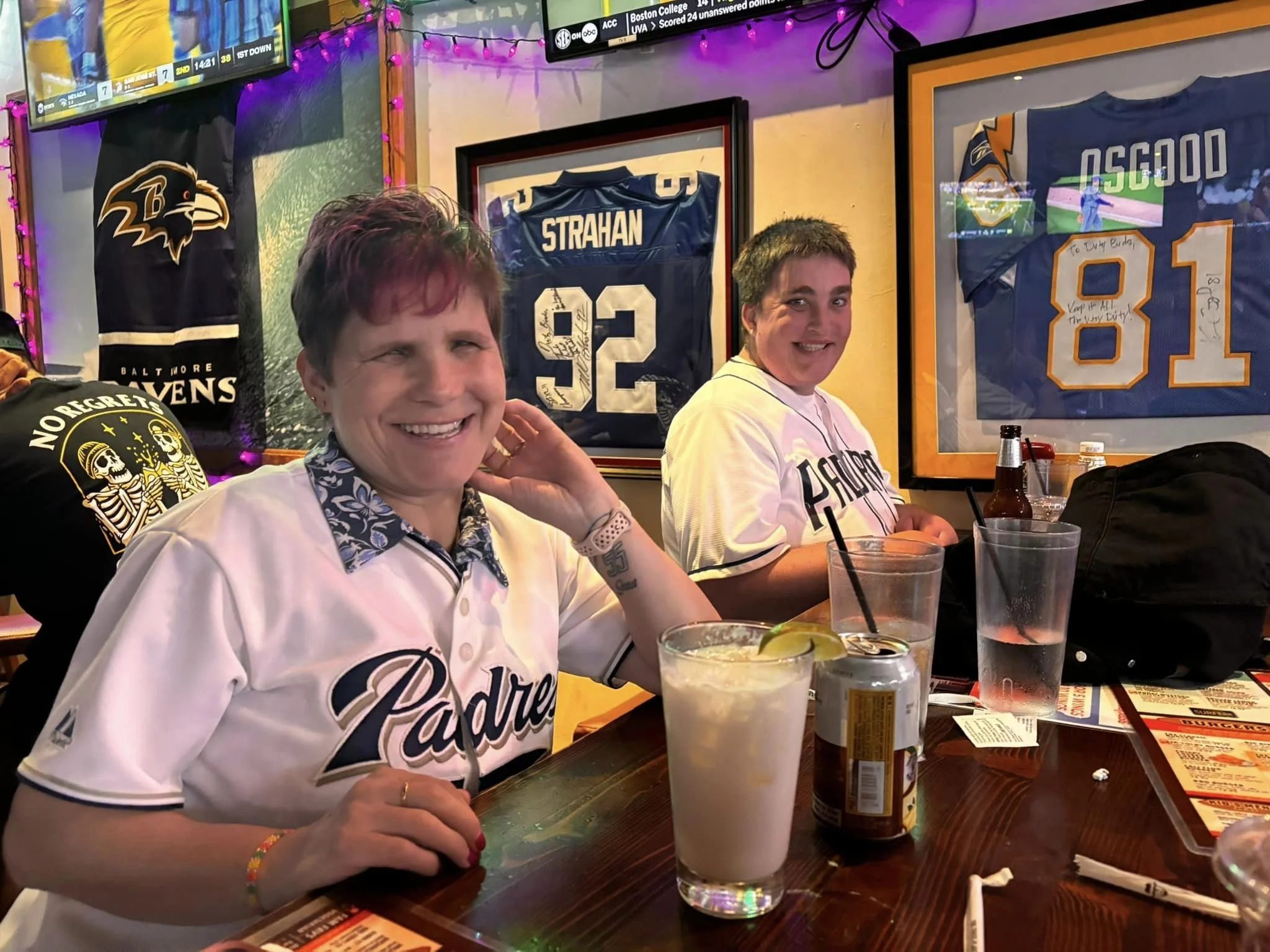 Two women with I/DD at a bar watching the Padres
