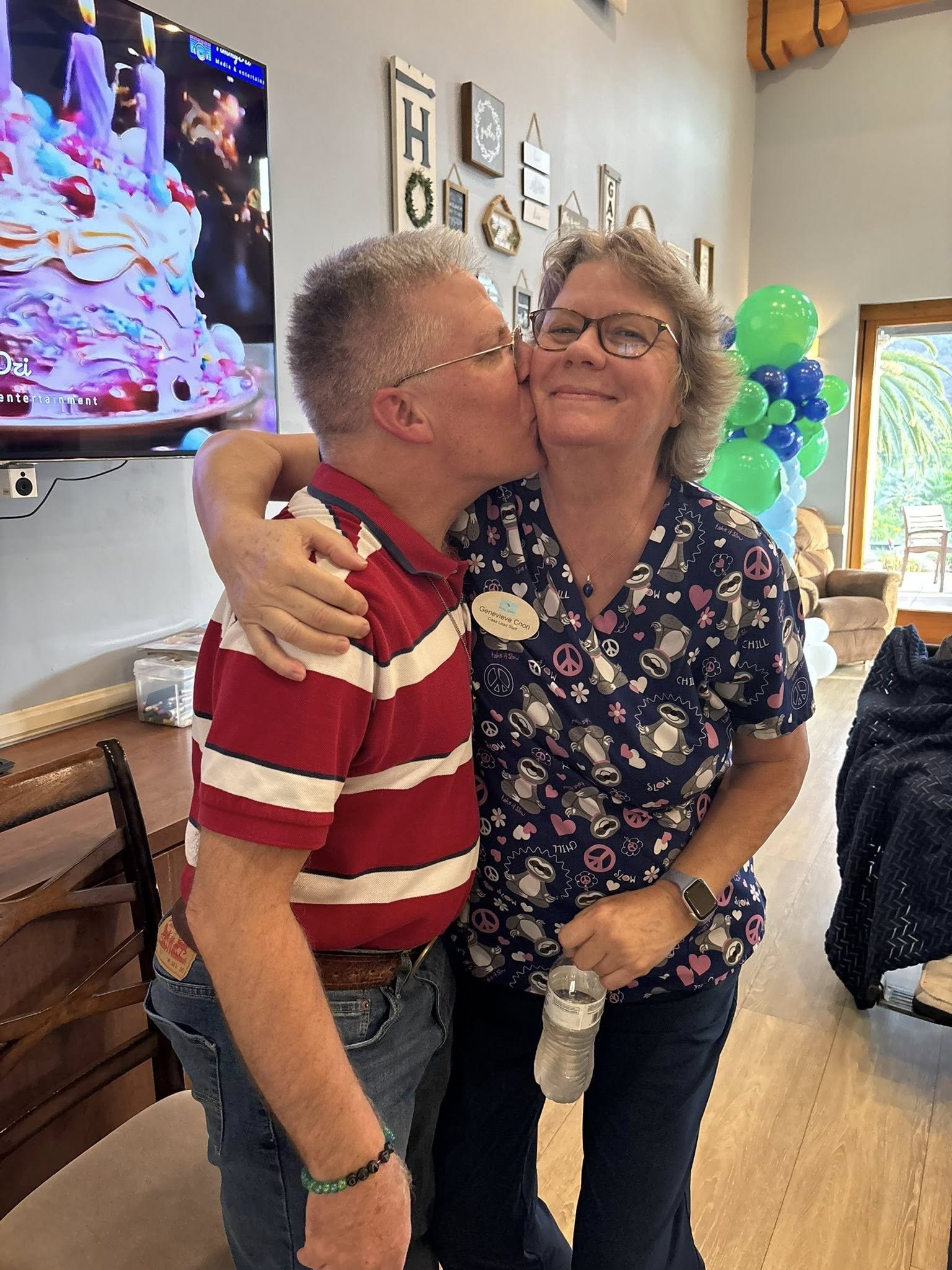 Man kissing woman on the cheek