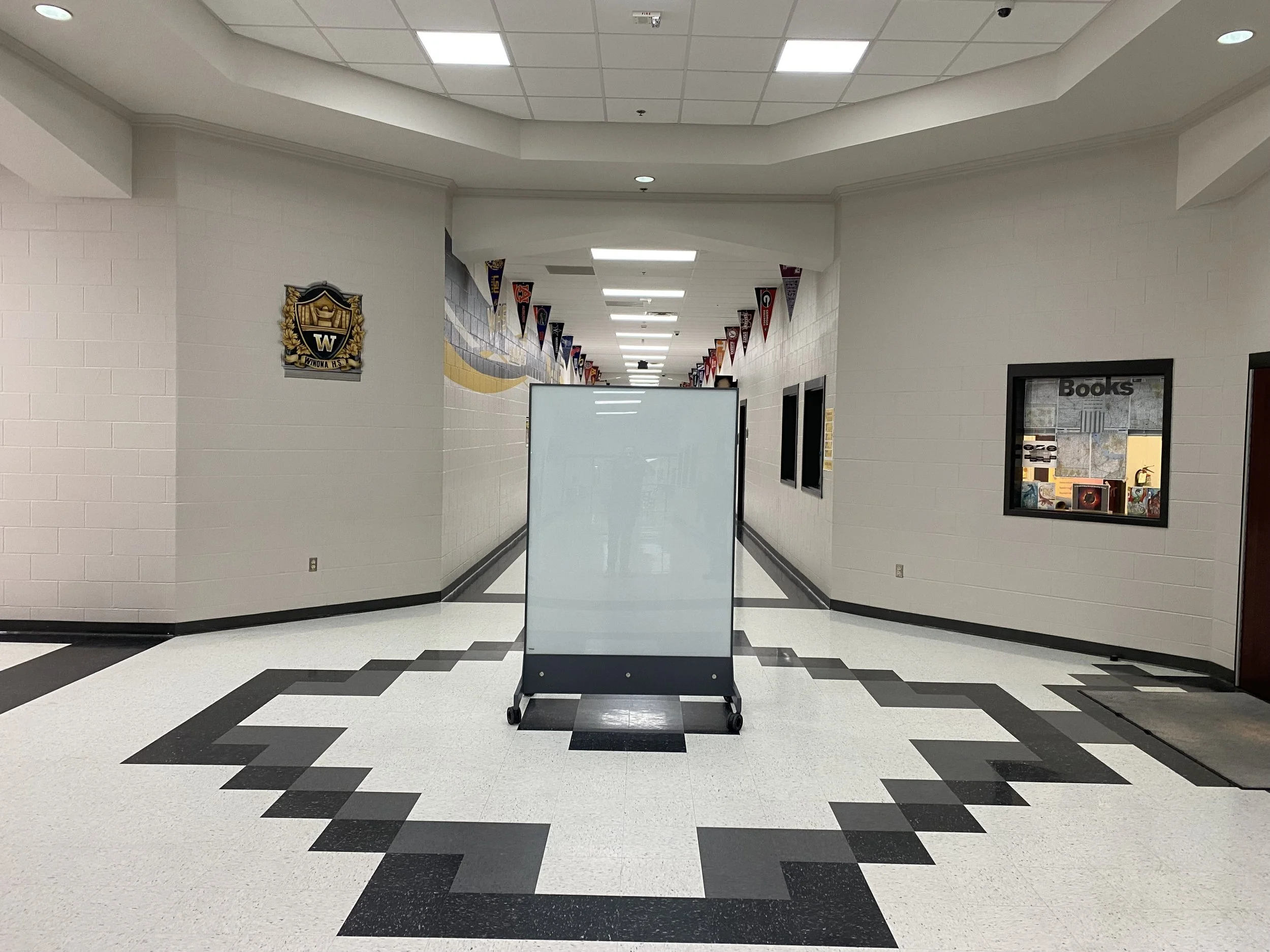 TAG Mobile bulletproof mobile whiteboard supporting layered school safety strategy in central school hallway