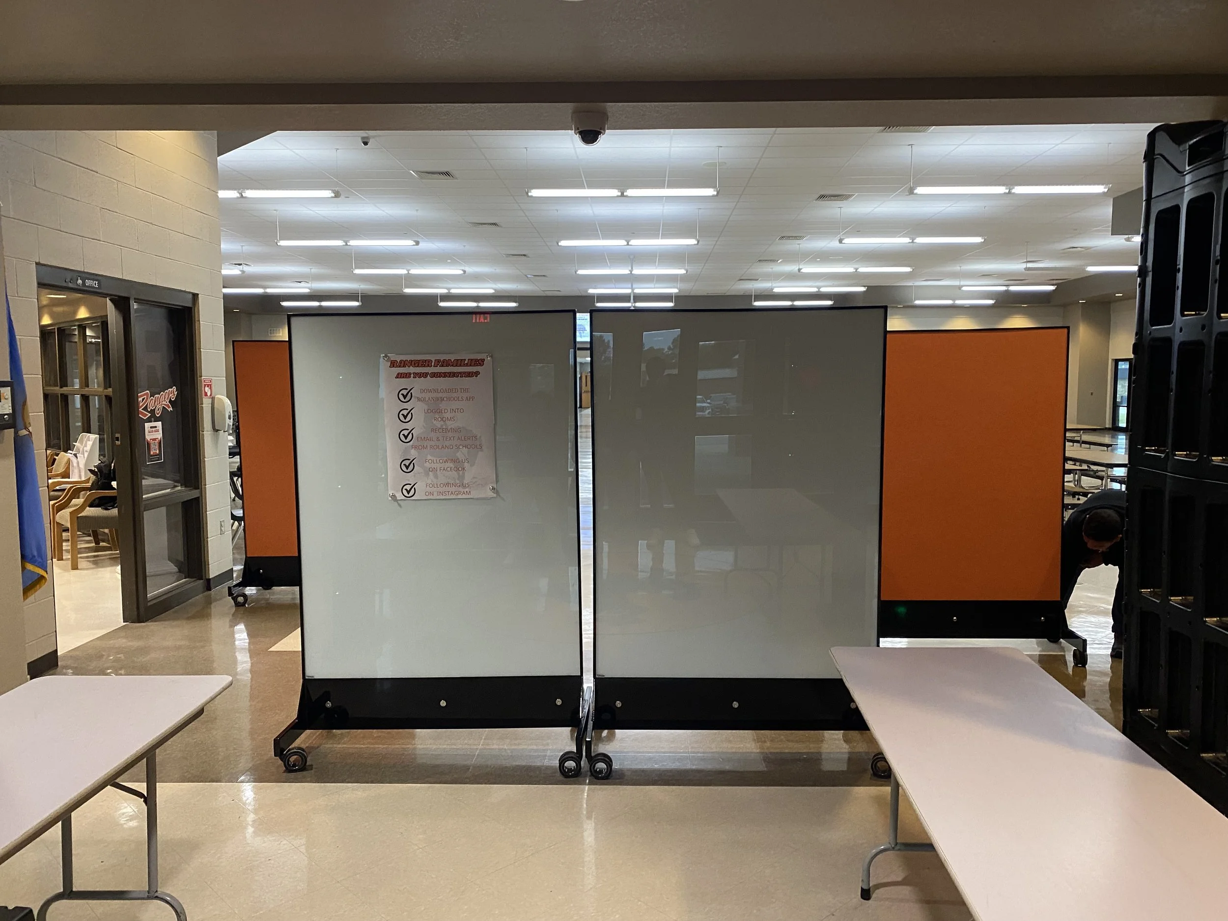 Four TAG Mobile™ bulletproof mobile whiteboards lined up inside a school entrance to block line of sight and provide discreet, UL 752 Level 8 ballistic protection.