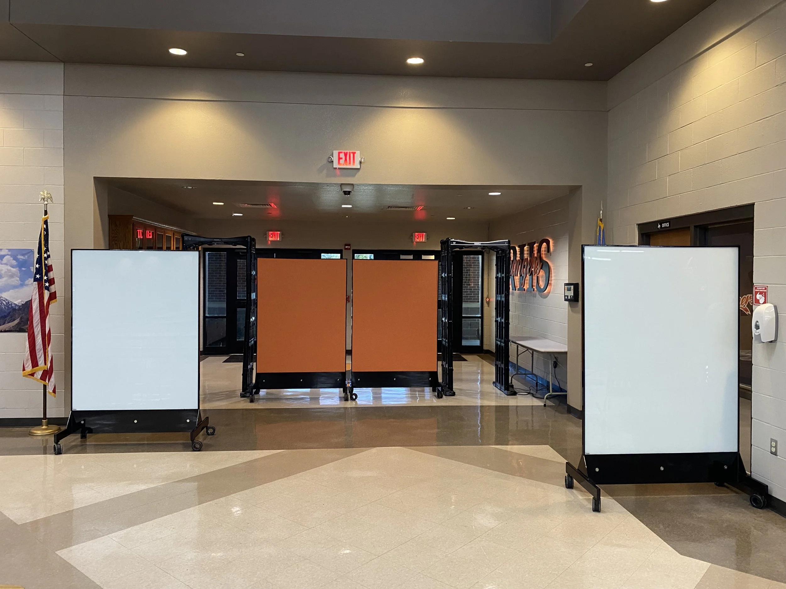 Multiple TAG Mobile bulletproof mobile whiteboards creating layered ballistic protection inside school entryway