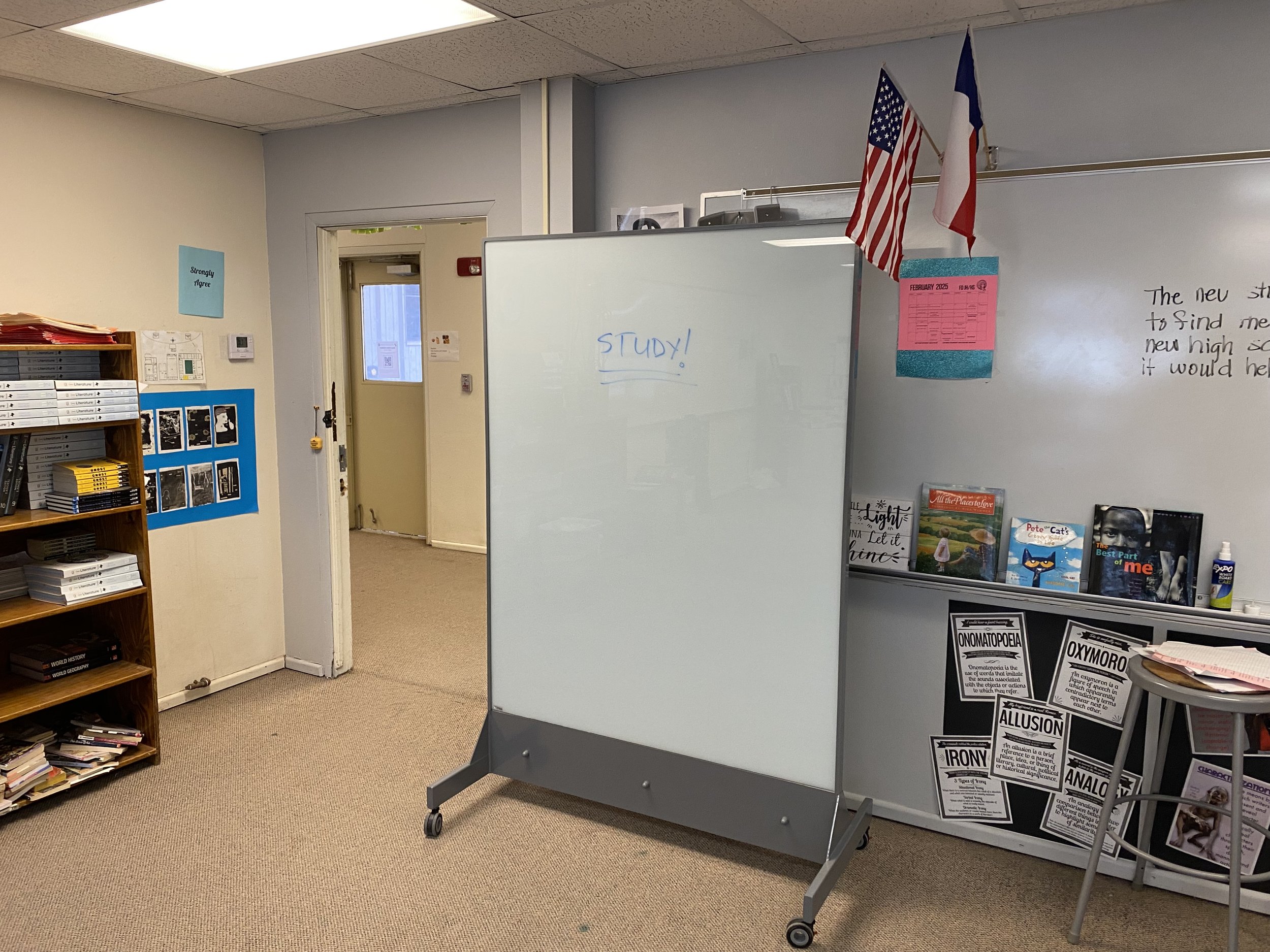 TAG Mobile ballistic whiteboard positioned in a classroom providing full-body ballistic protection and a daily-use teaching surface for students and teachers.