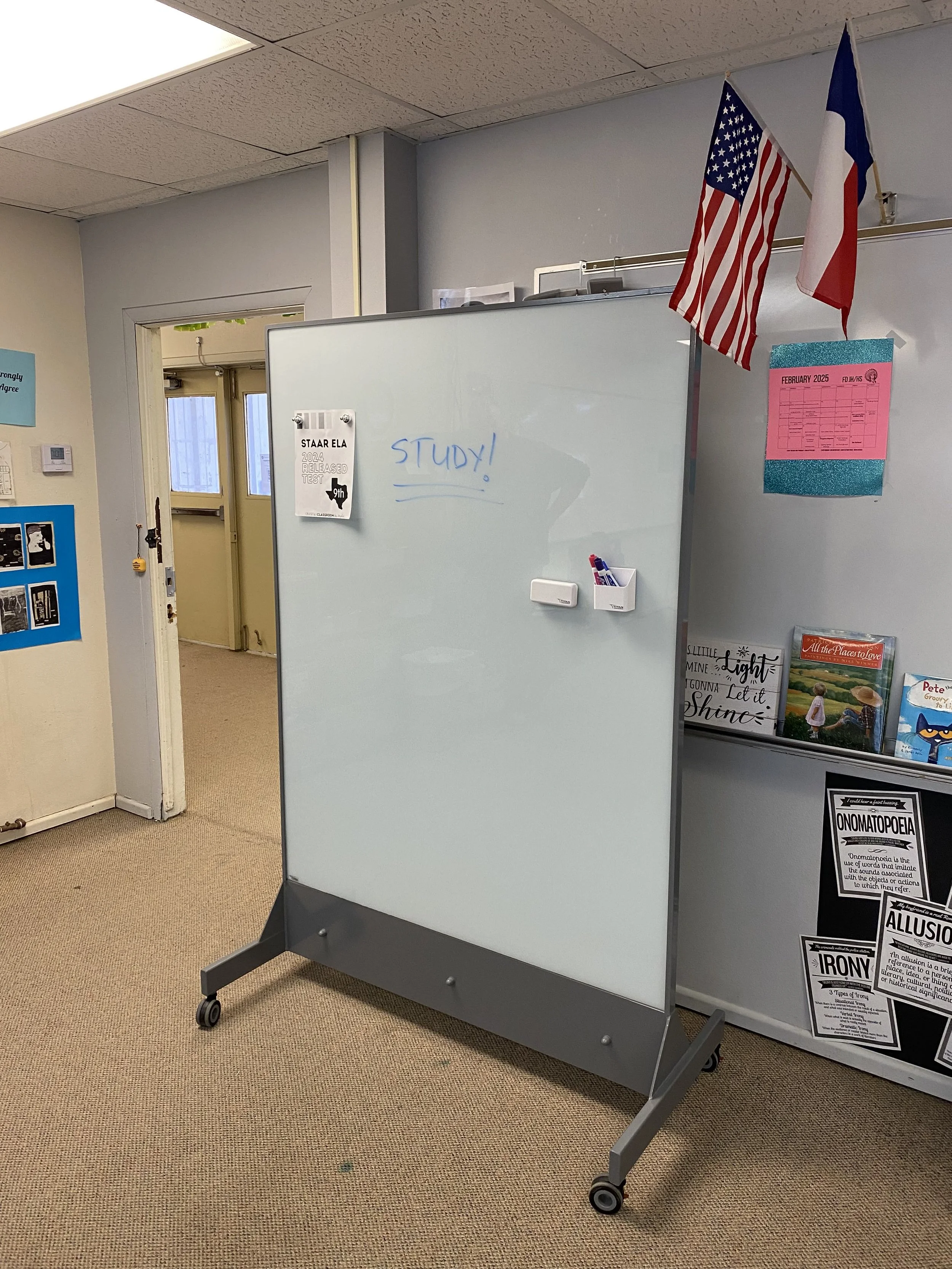 TAG Mobile UL 752 Level 8 bulletproof mobile whiteboard in a classroom, shown with “Study!” written on the glass and instructional materials attached using magnets. Designed as a dual-purpose teaching tool and ballistic shield for school safety.