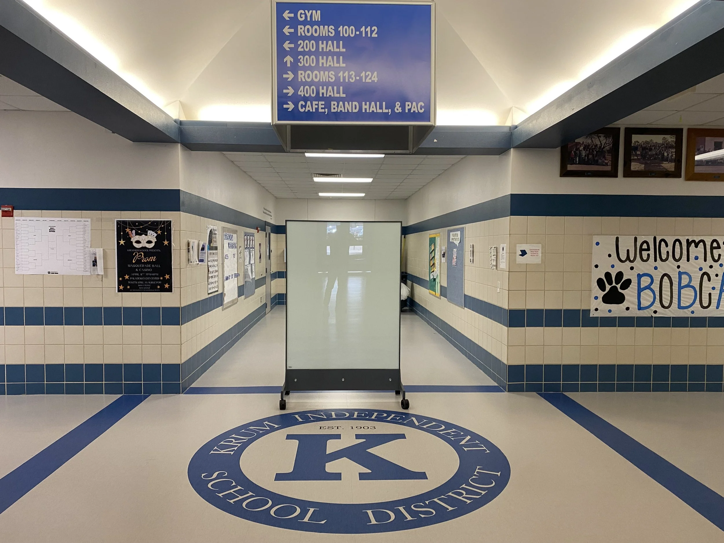 TAG Mobile bulletproof whiteboard placed in a school hallway to provide accessible mobile ballistic protection.