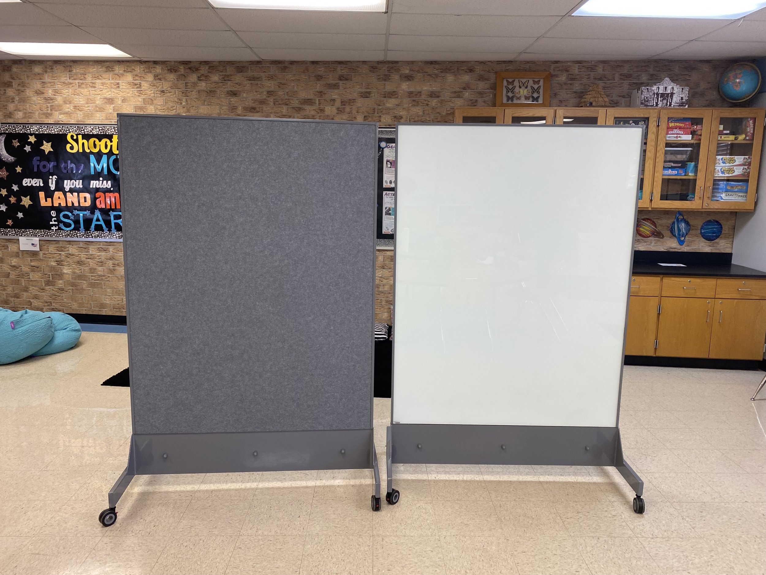 TAG Mobile ballistic whiteboard positioned in a classroom providing full-body ballistic protection and a daily-use teaching surface for students and teachers.