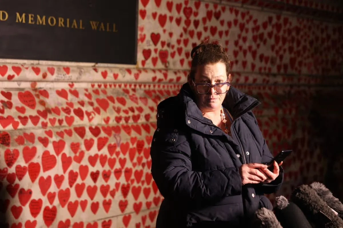 A CBFJ spokesperson speaking to the media in front of the National Covid Memorial Wall