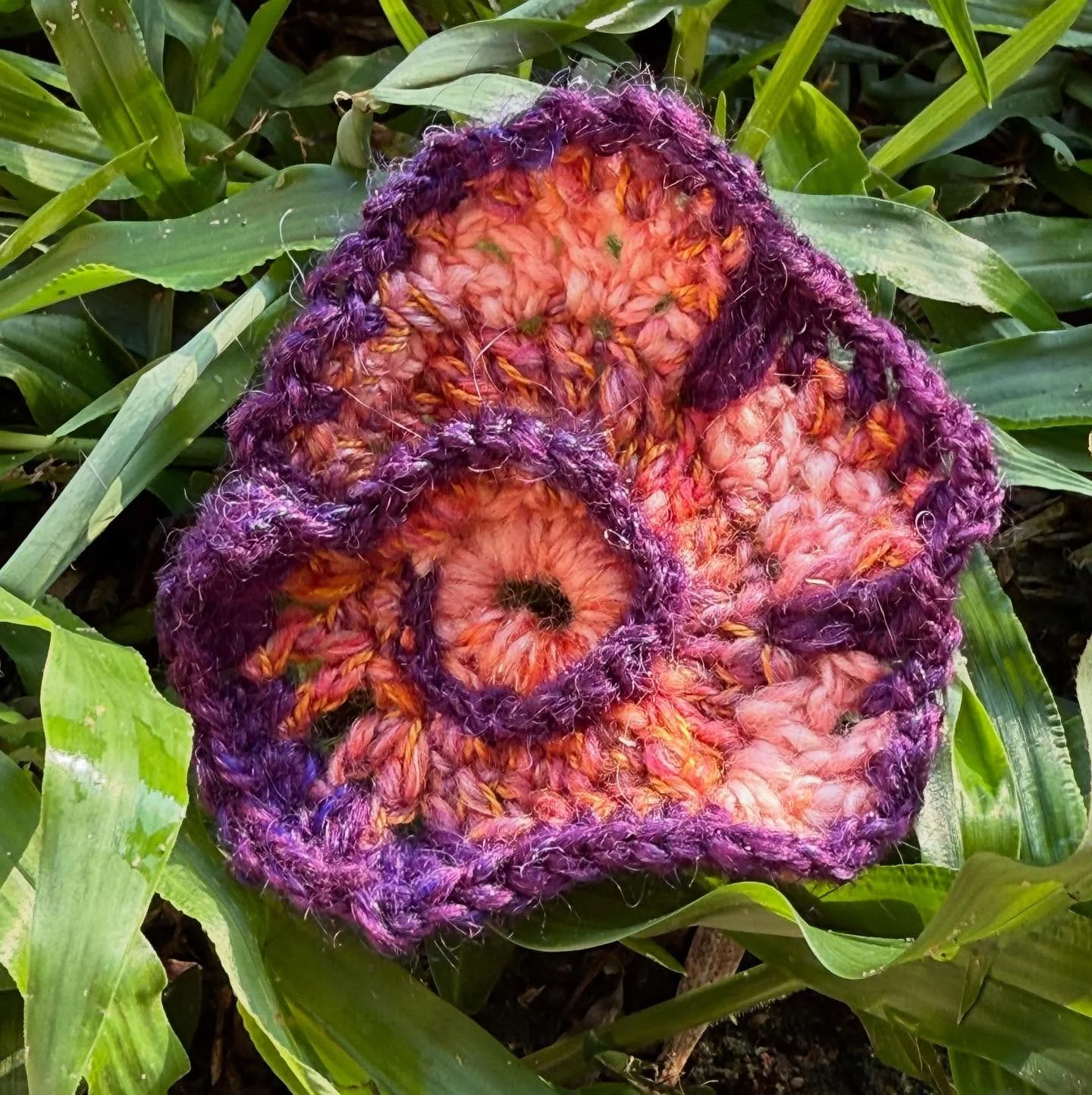 A completely freeform shape that, with the addition of a glorious violet hand spun edging, becomes an abstract pansy growing in the grass. Violet, orange and green are secondary colors that create a beautiful start to the day.